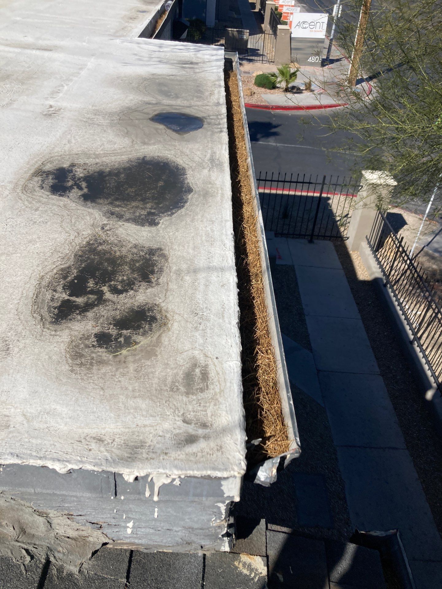 Commercial gutter cleaning North Las Vegas before photo with filled gutters
