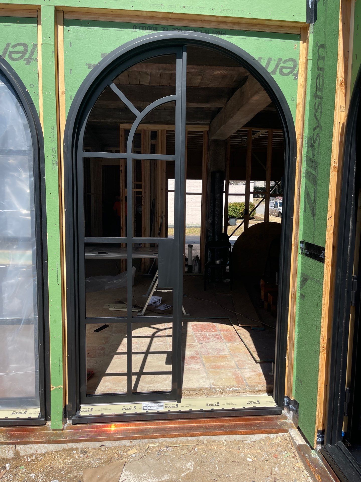 Arched Black Metal French Door Installation and Finishing in Fort Worth by Solara Custom Living
