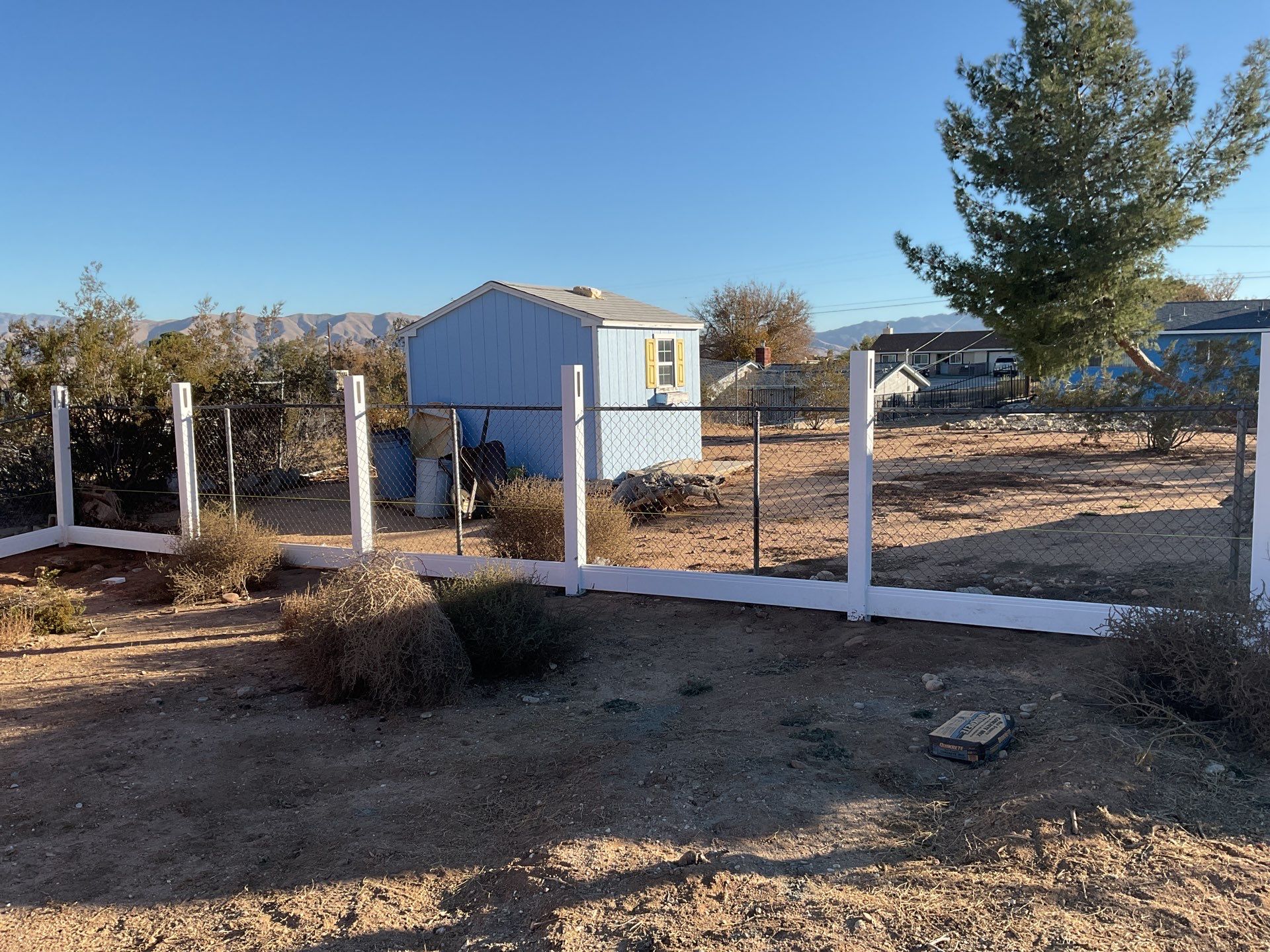 Fence Installation using vinyl and chain link  by Fence Guys Inc. 