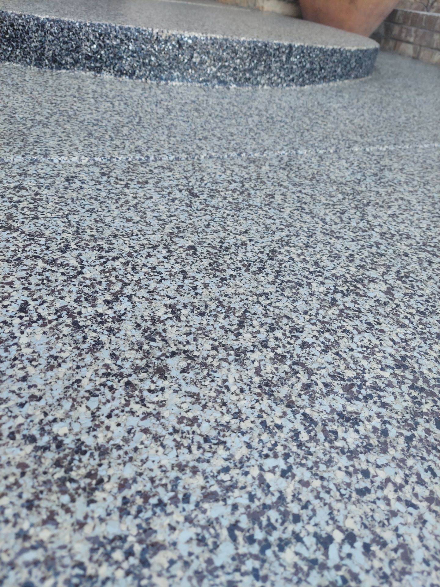 Patio Coating Installation using Cordwood by Copperhead Coatings