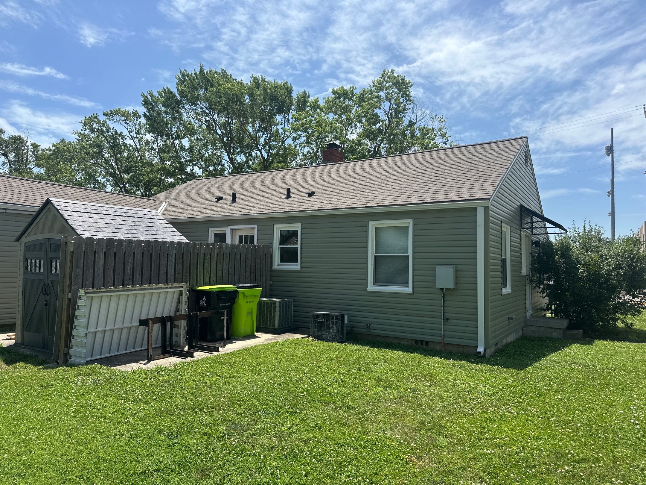 New Cypress Siding going on this North Kansas City Home  by EEC  Windows, Siding & Roofing 