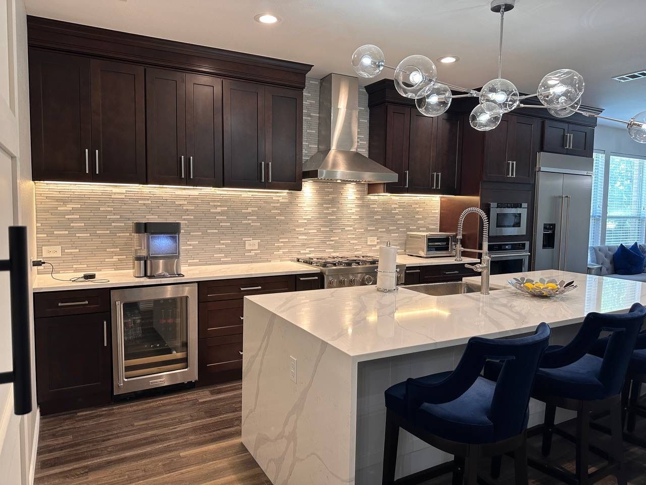 Kitchen Remodel using Calacata Quartz by Construction Nation Group