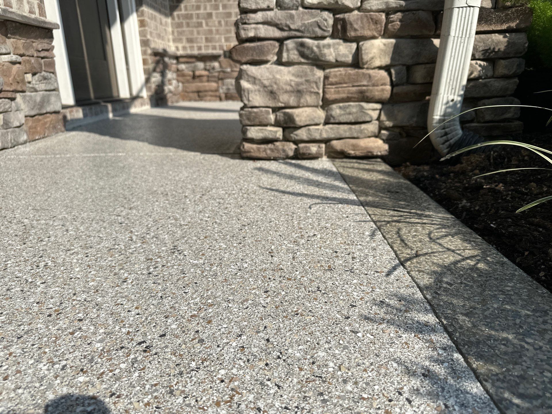 Driveway Improvement Using Claystone With Trail Mix Border! by Elite Floor Solutions