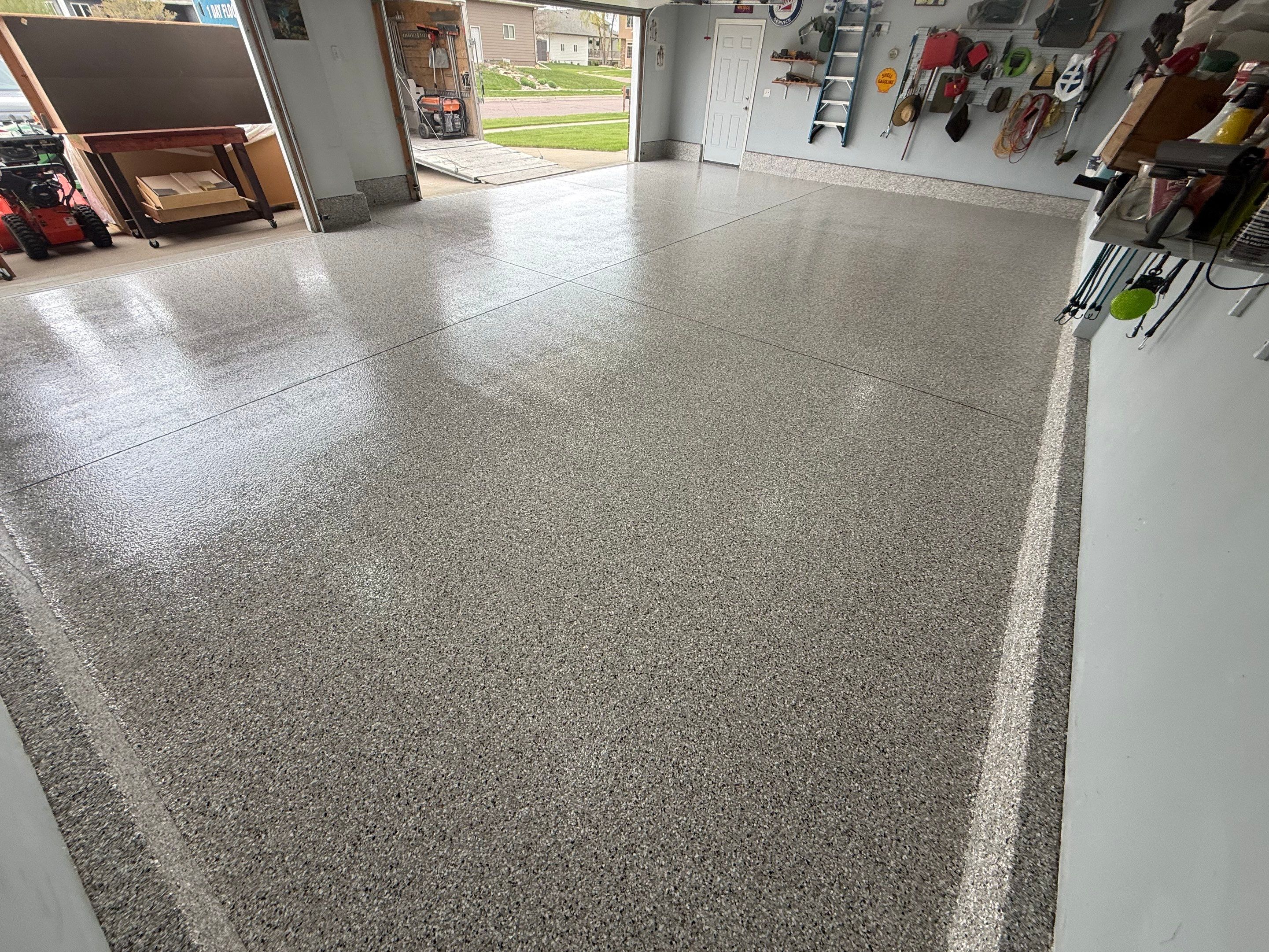 High-Gloss Epoxy Garage Floor Coating in Sioux Falls by Select Painting, Coatings & Garage Cabinets