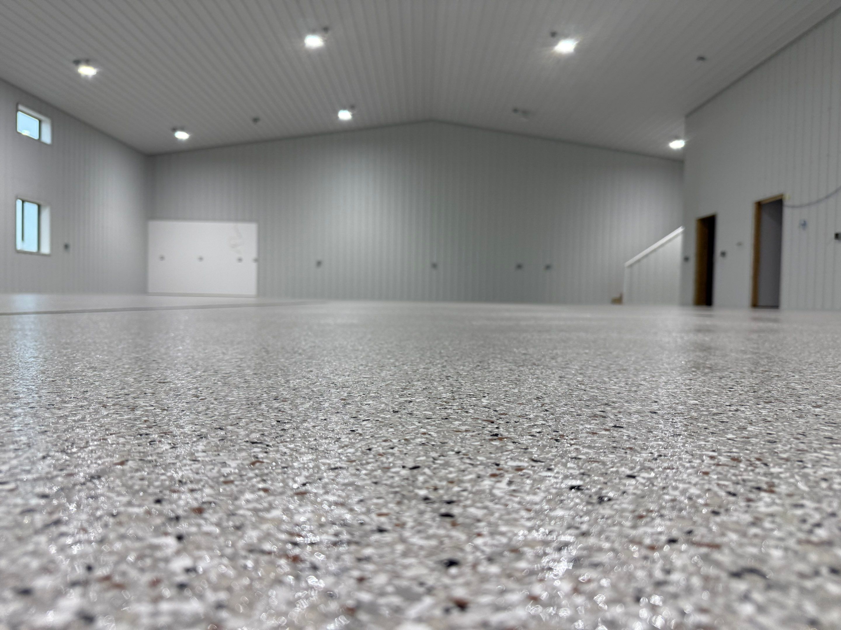 Custom Speckled Floor Coating for Large Montrose Shop by Select Painting, Coatings & Garage Cabinets