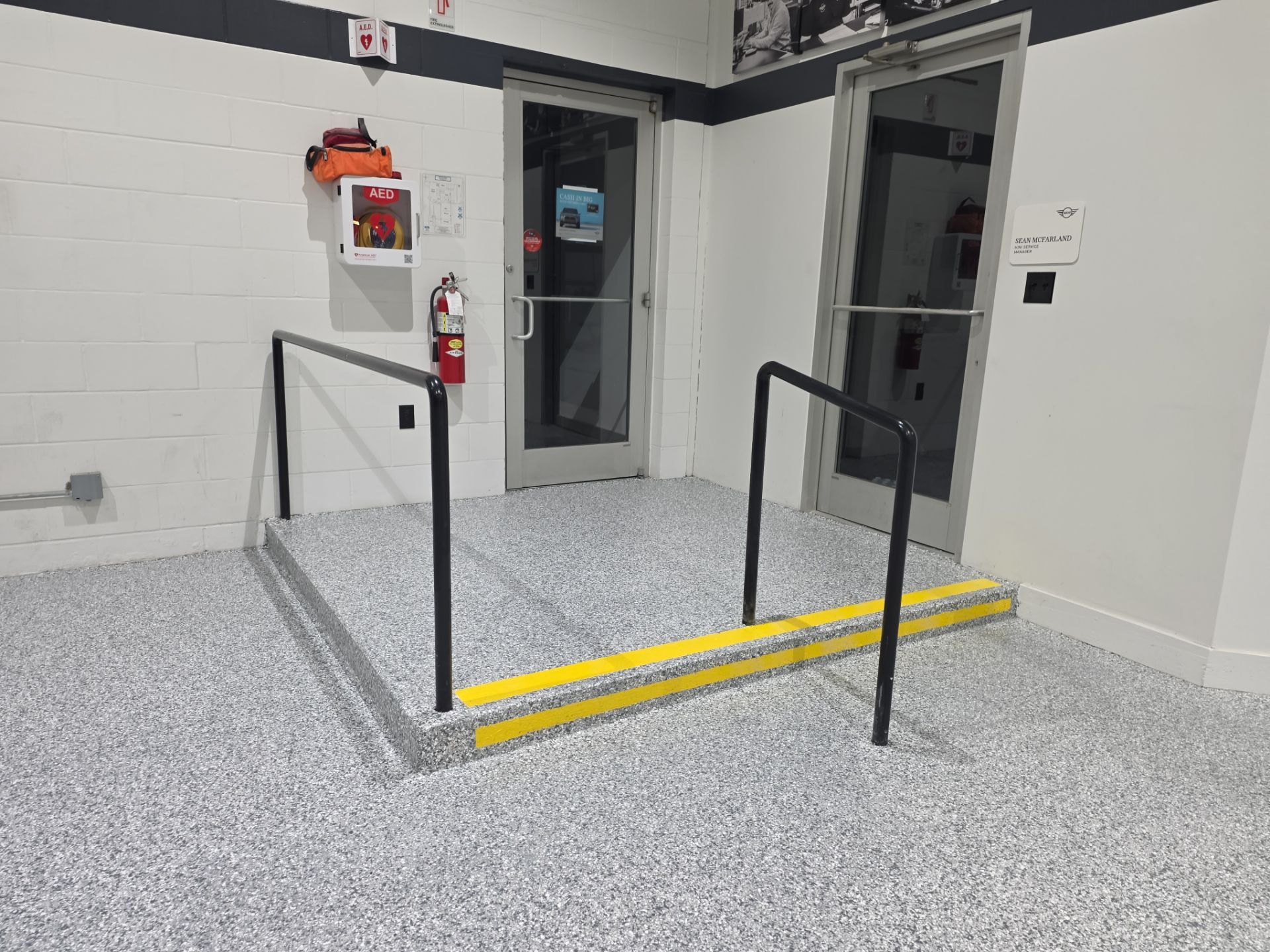 Mini Cooper Commercial Epoxy Floor Installation by Revival Concrete Coatings