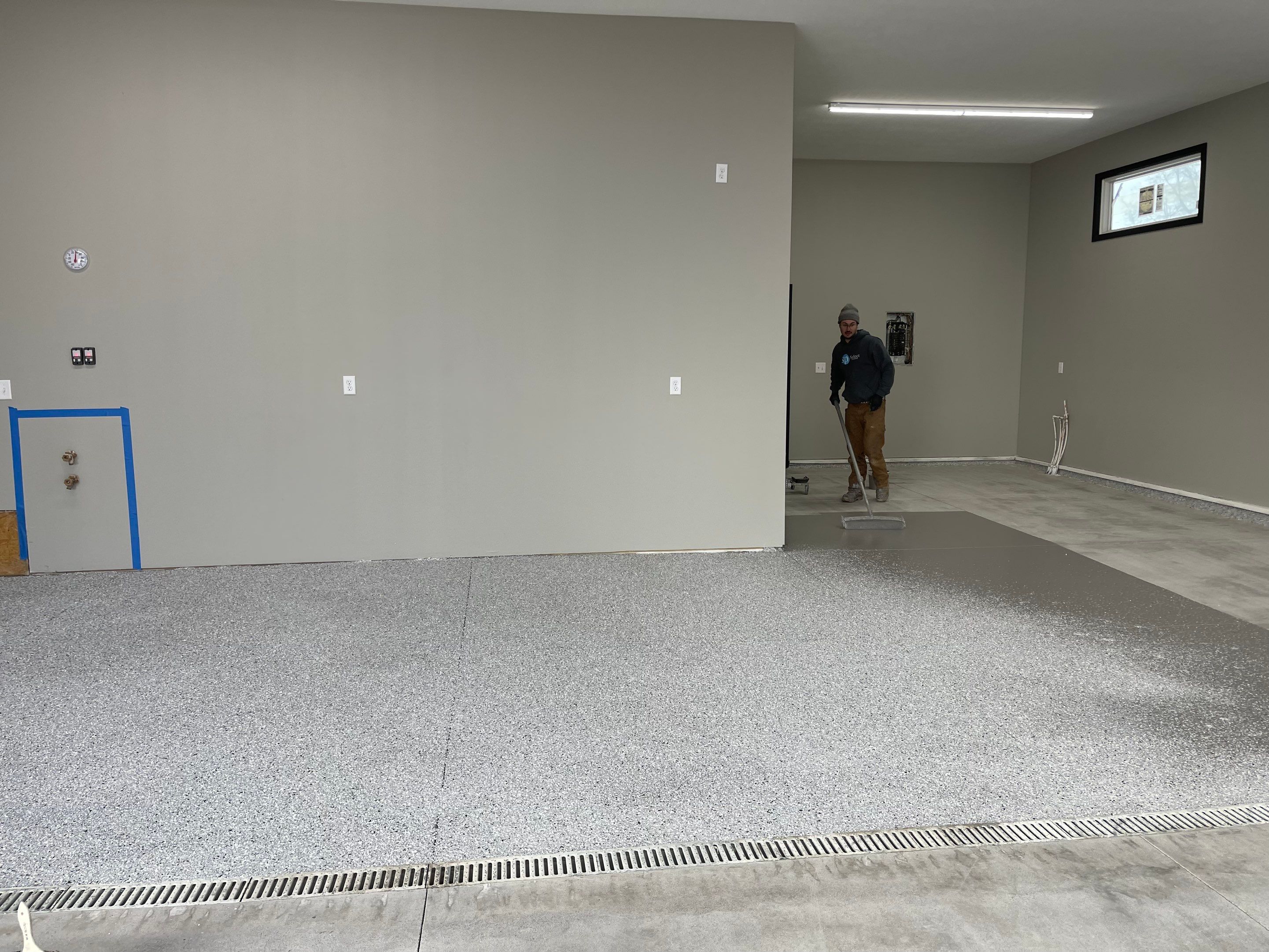 Decorative Flake Concrete Coating Installation in North Sioux City by Select Painting, Coatings & Garage Cabinets
