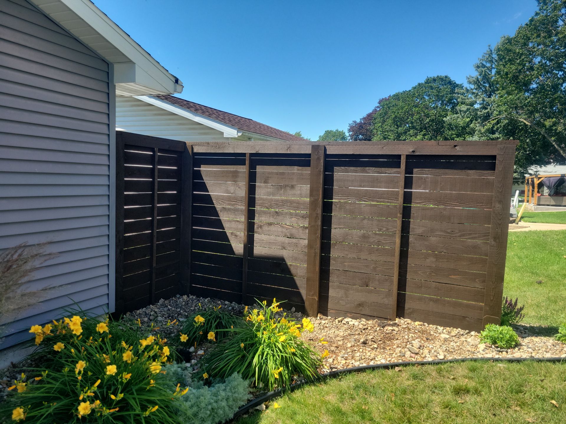 Custom Horizontal Slat Privacy Cedar Chocolate Screen Installation in Hudson by Perfect Picket Fence and Stain