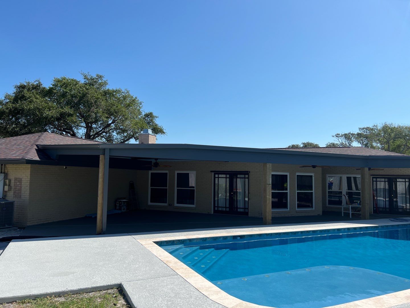 Beautiful pool side build by Bayfront Roofing and Construction