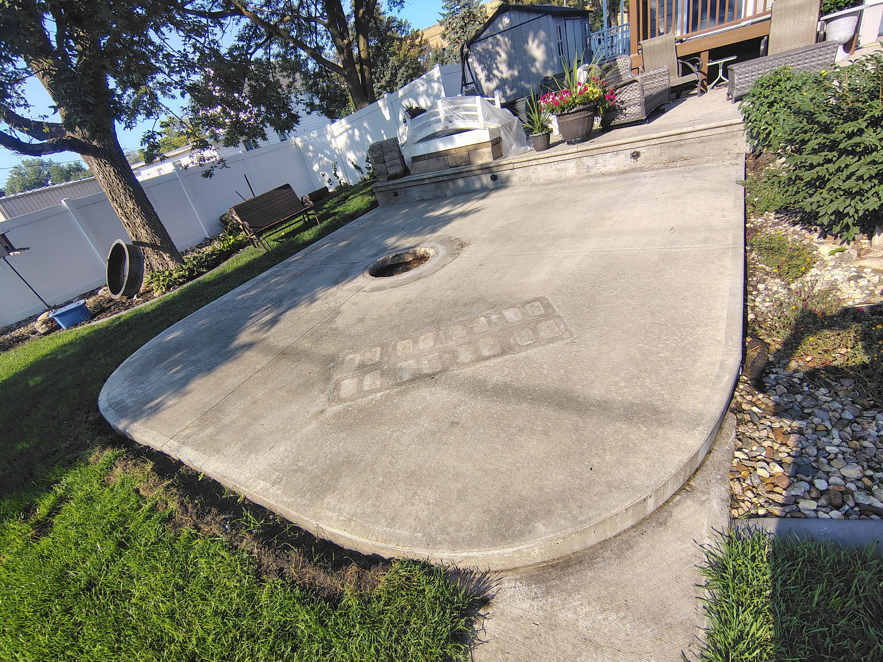 Custom Garage Floor Coating and Backyard Patio Refinishing in Tyndall by Select Painting, Coatings & Garage Cabinets