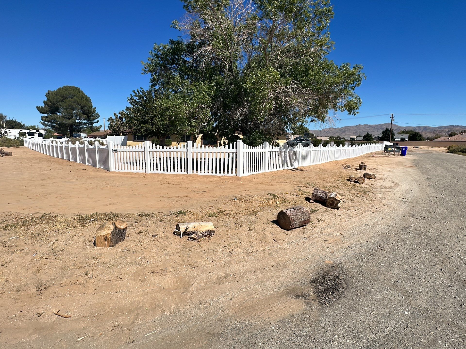 White picket fence  by Fence Guys Inc. 