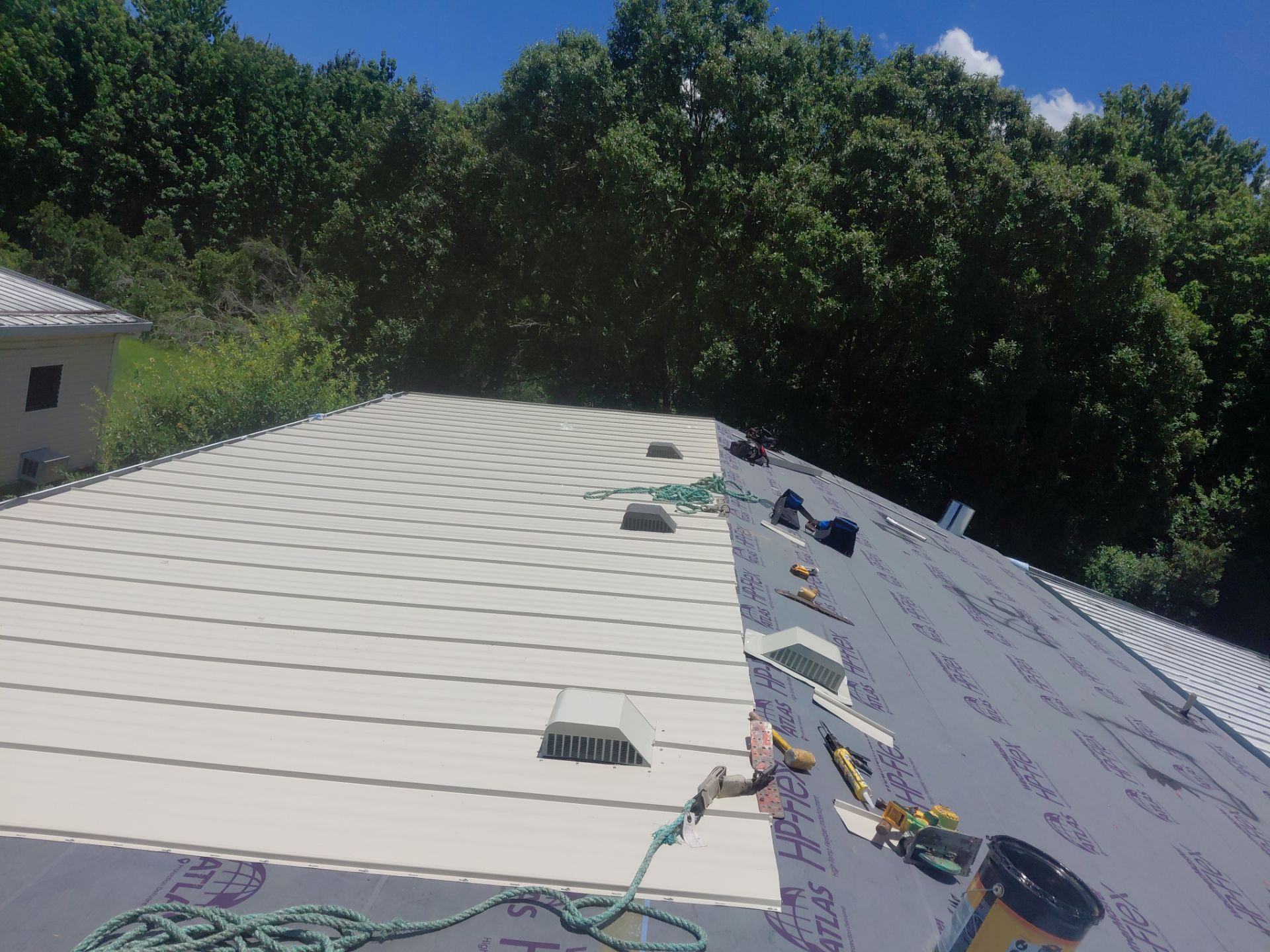 Orlando Residential Standing Seam Metal Roof Installation in Light Stone by Pinnacle Roofing Group