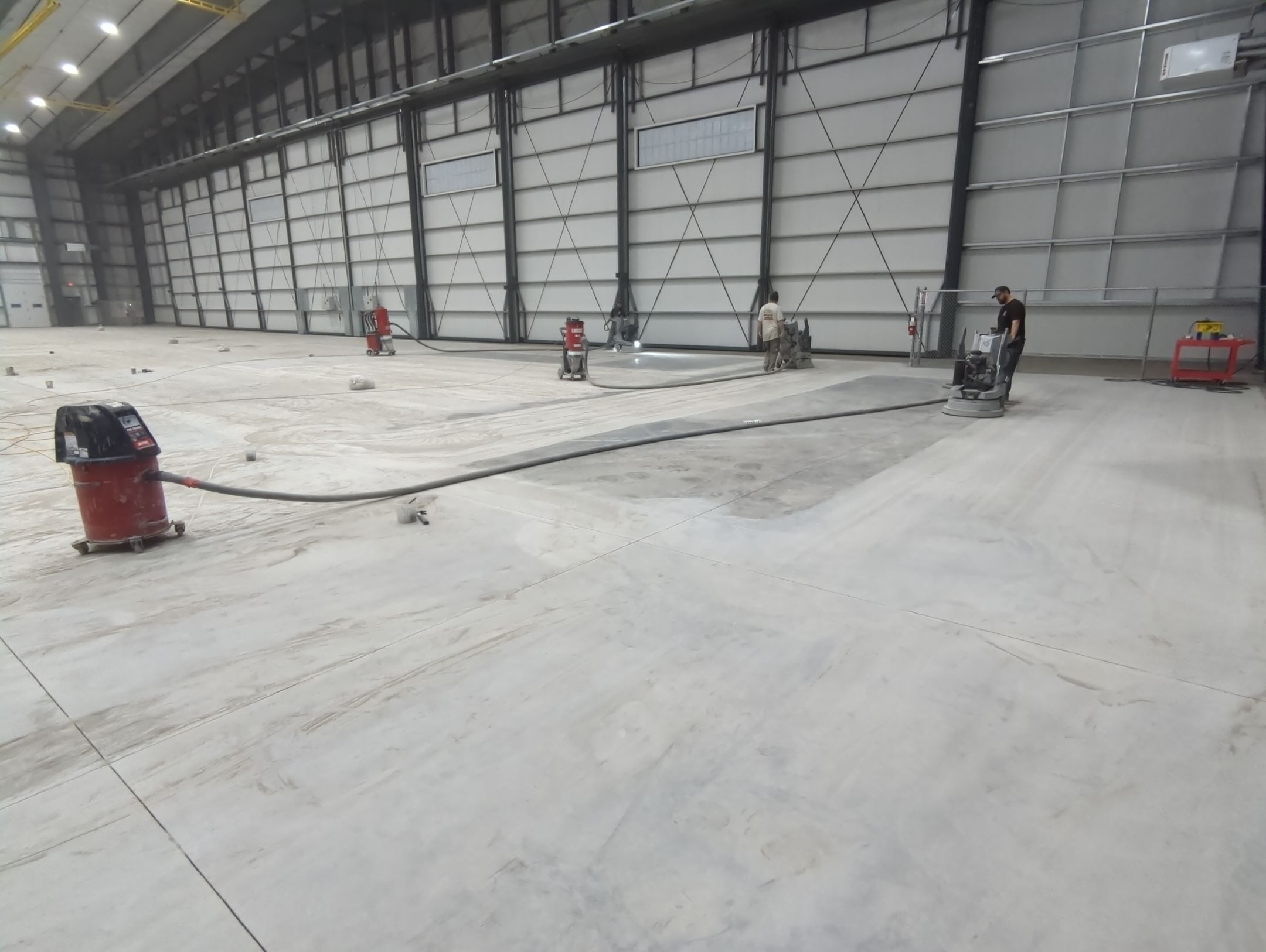 Airplane Hanger using Light Grey Commercial Penntek Epoxy by Croc Coatings, LLC