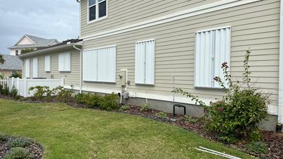 Hurricane Shutters using Accordions in White