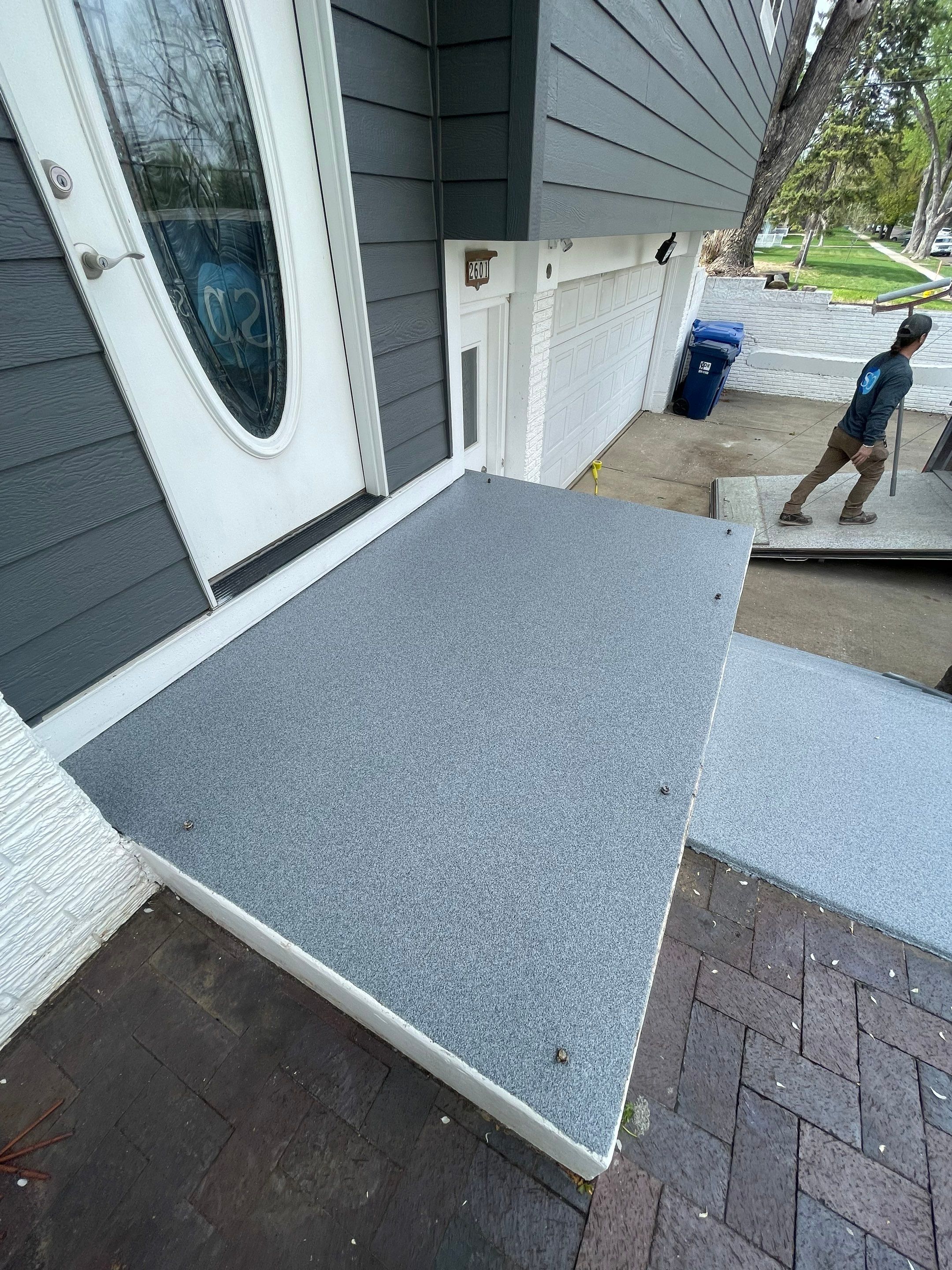 Grey Polyaspartic Porch and Stair Resurfacing in Sioux Falls by Select Painting, Coatings & Garage Cabinets