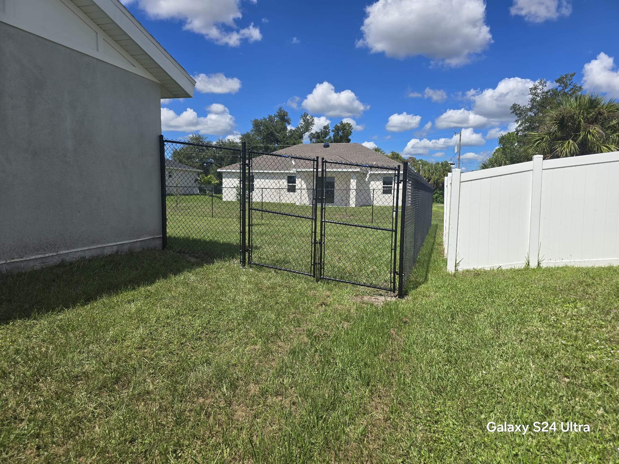 Residential Black Chain Link Fence Installation in North Port by True Fence LLC