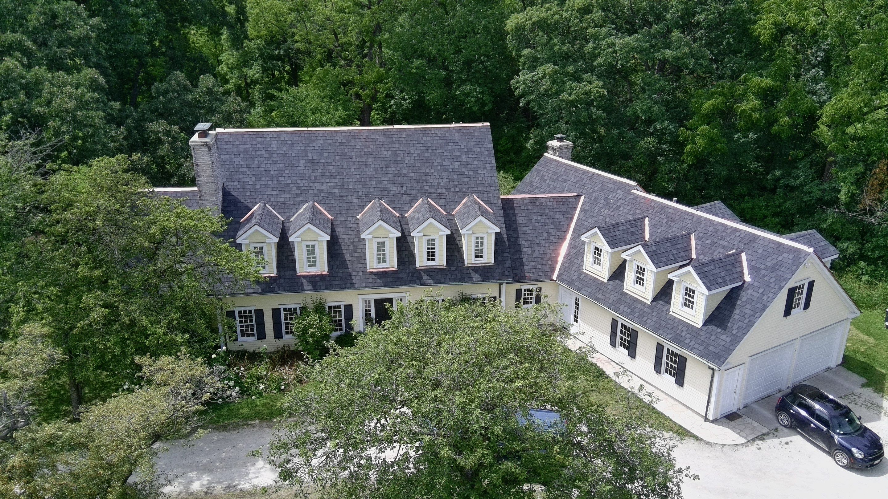 Re-roof: Certainteed Belmont in Black Granite with Custom Copper by Midwest Building Solutions