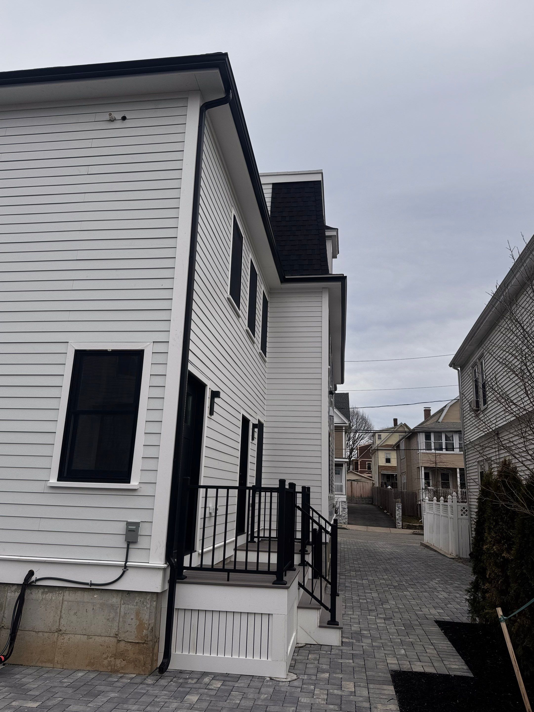 Black Gutter Installation by JOHNNYS PRO