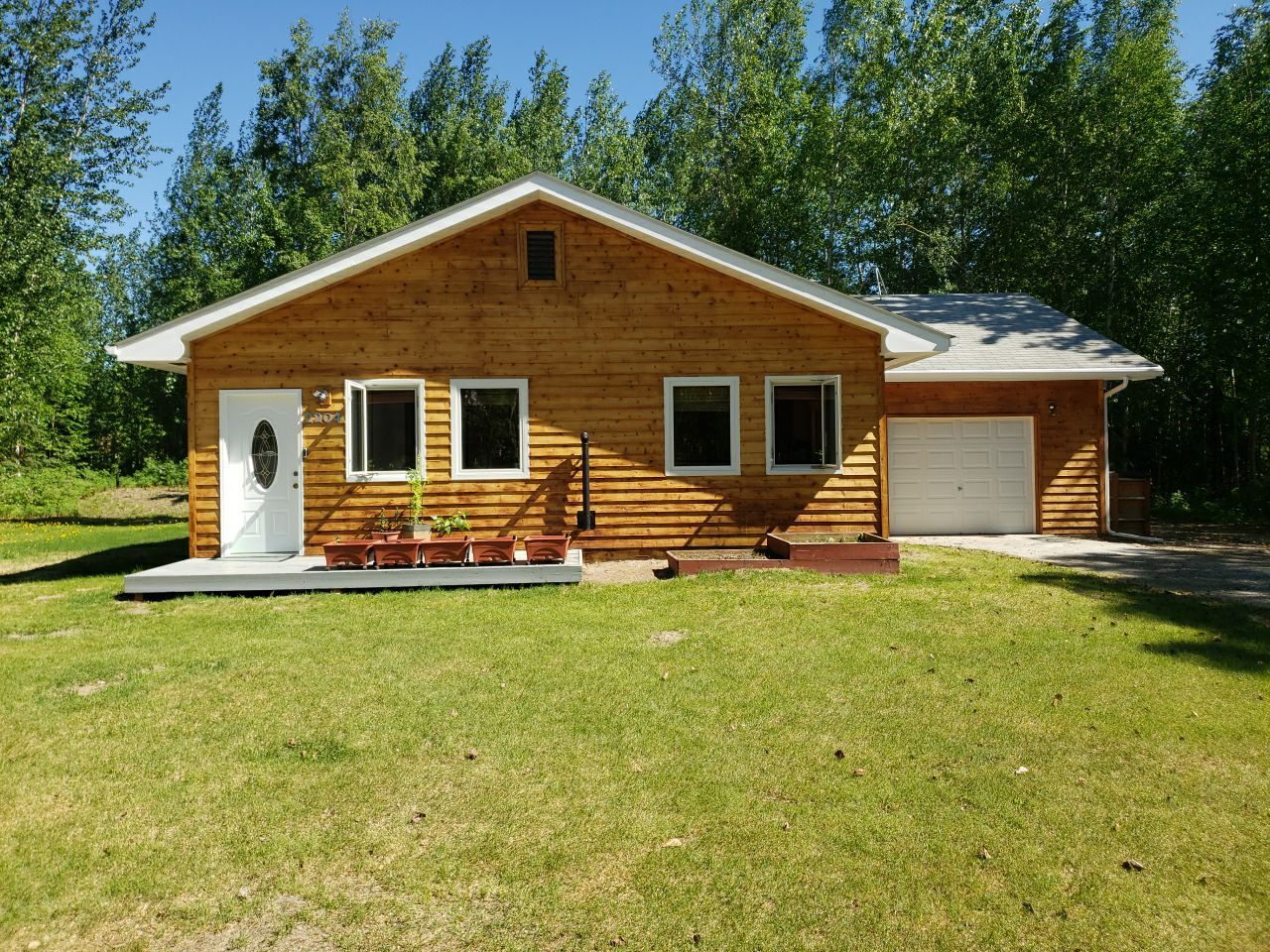 Brightened Cedar Siding & Garage by Midnight Sun Painting