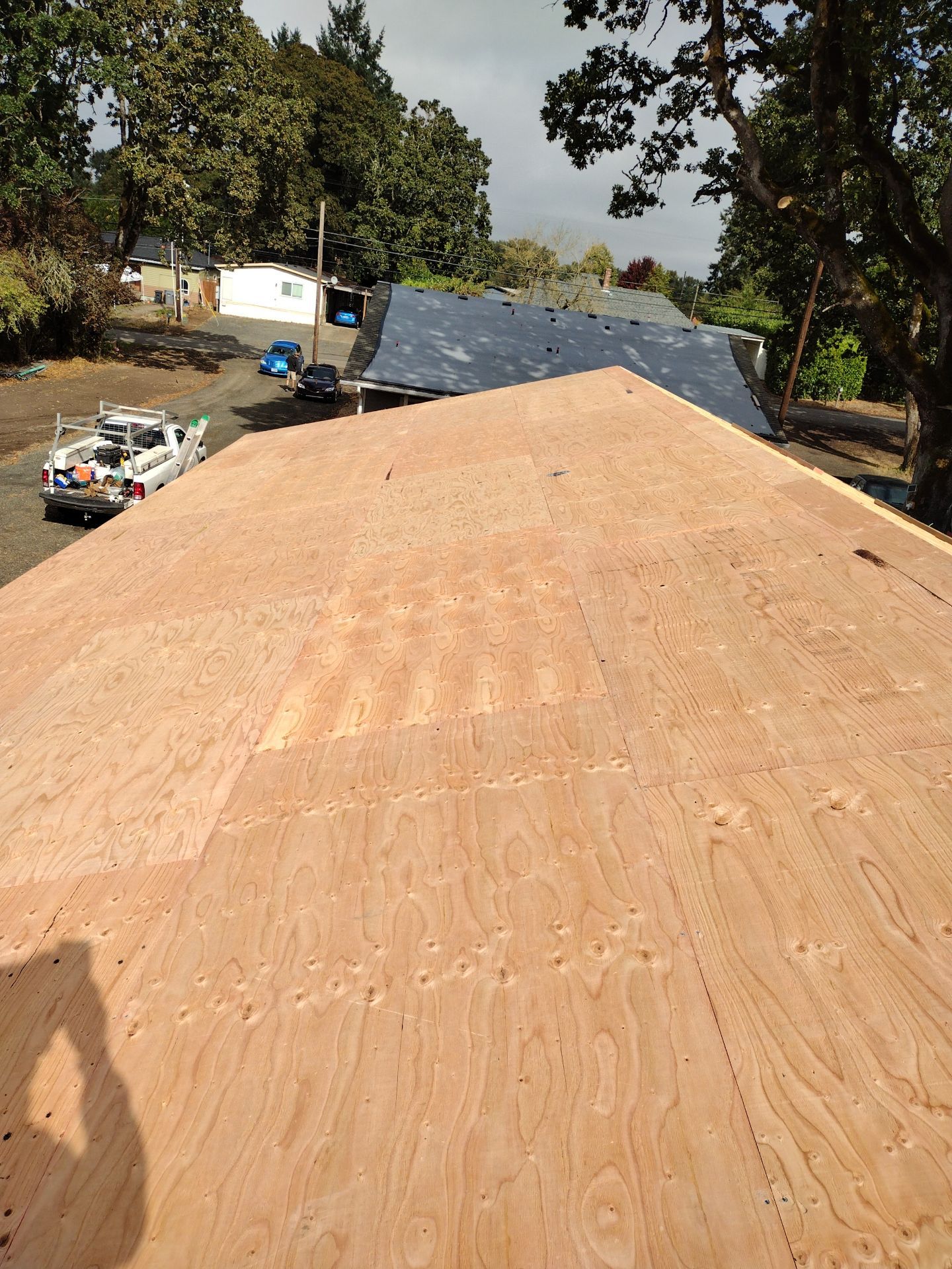 Grey Habitat for Humanity Metal Roof by Orezona Building & Roofing Company, Inc.