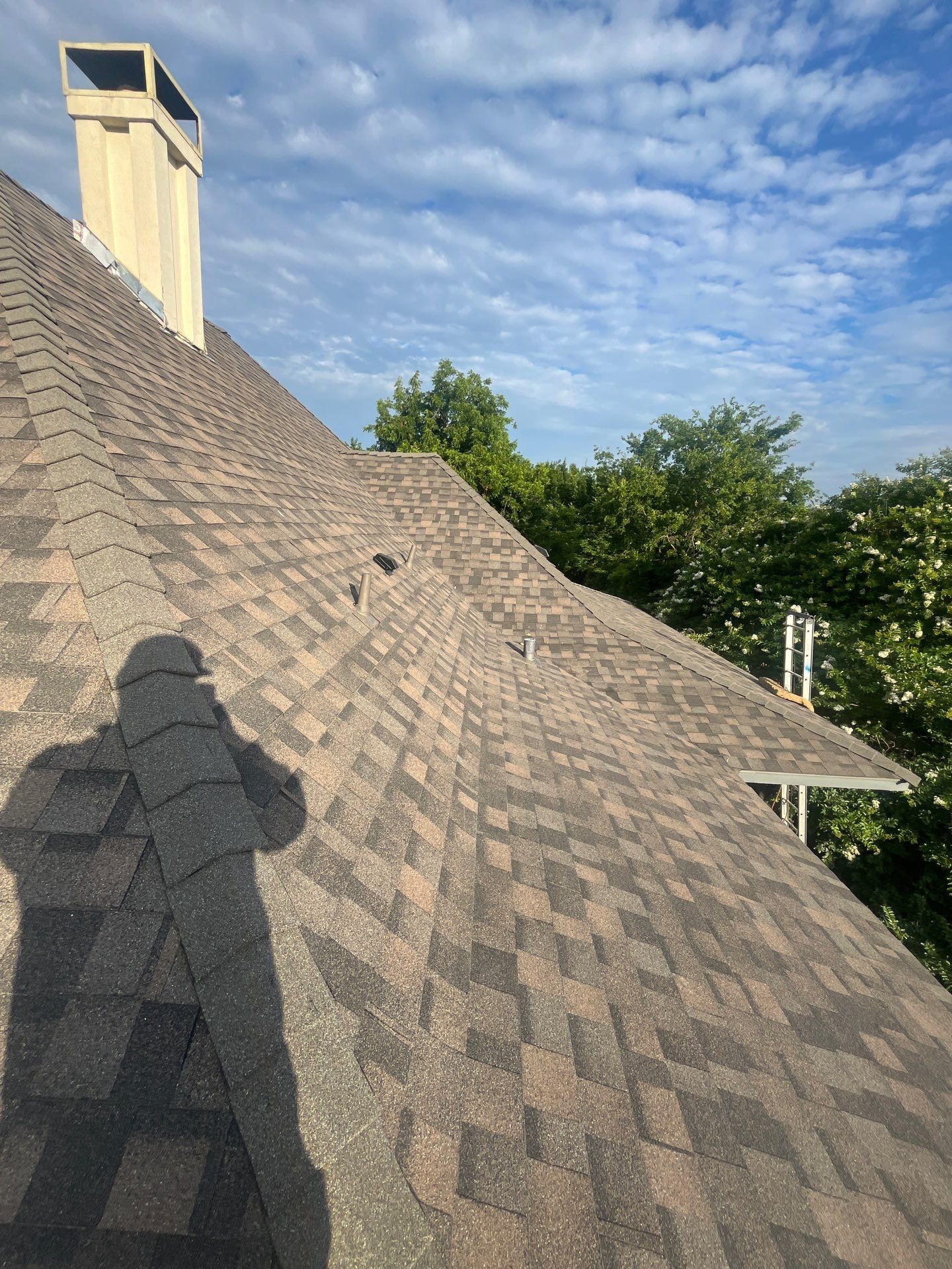 Tan exterior with IKO Driftshake by Tejas Roofworks + Restoration