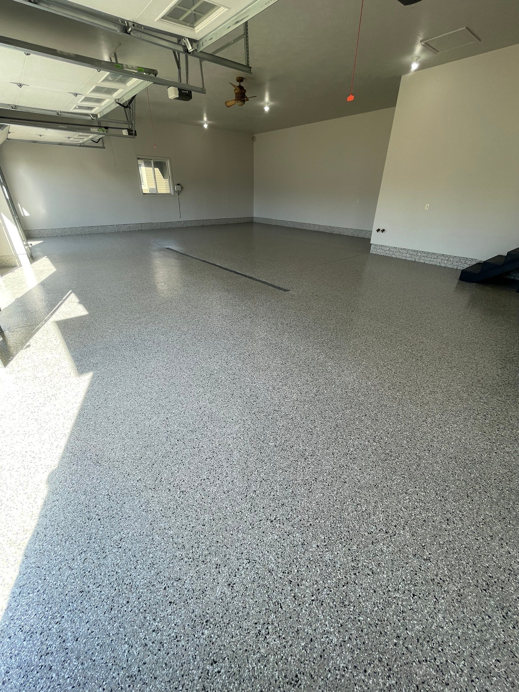 Multi-Car Garage Epoxy Floor Coating in Beresford by Select Painting, Coatings & Garage Cabinets