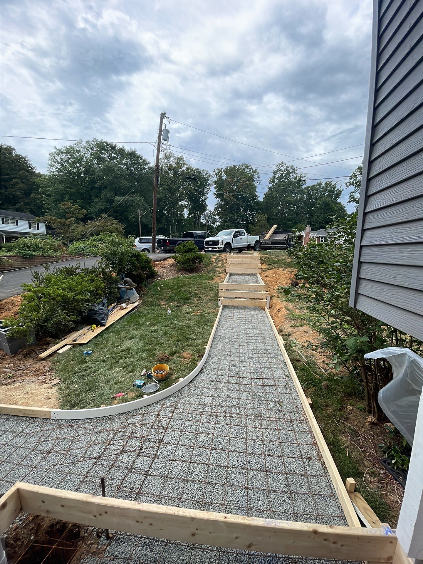 New walkway with stairs and a new front porch by Fairfax Contractors, LLC