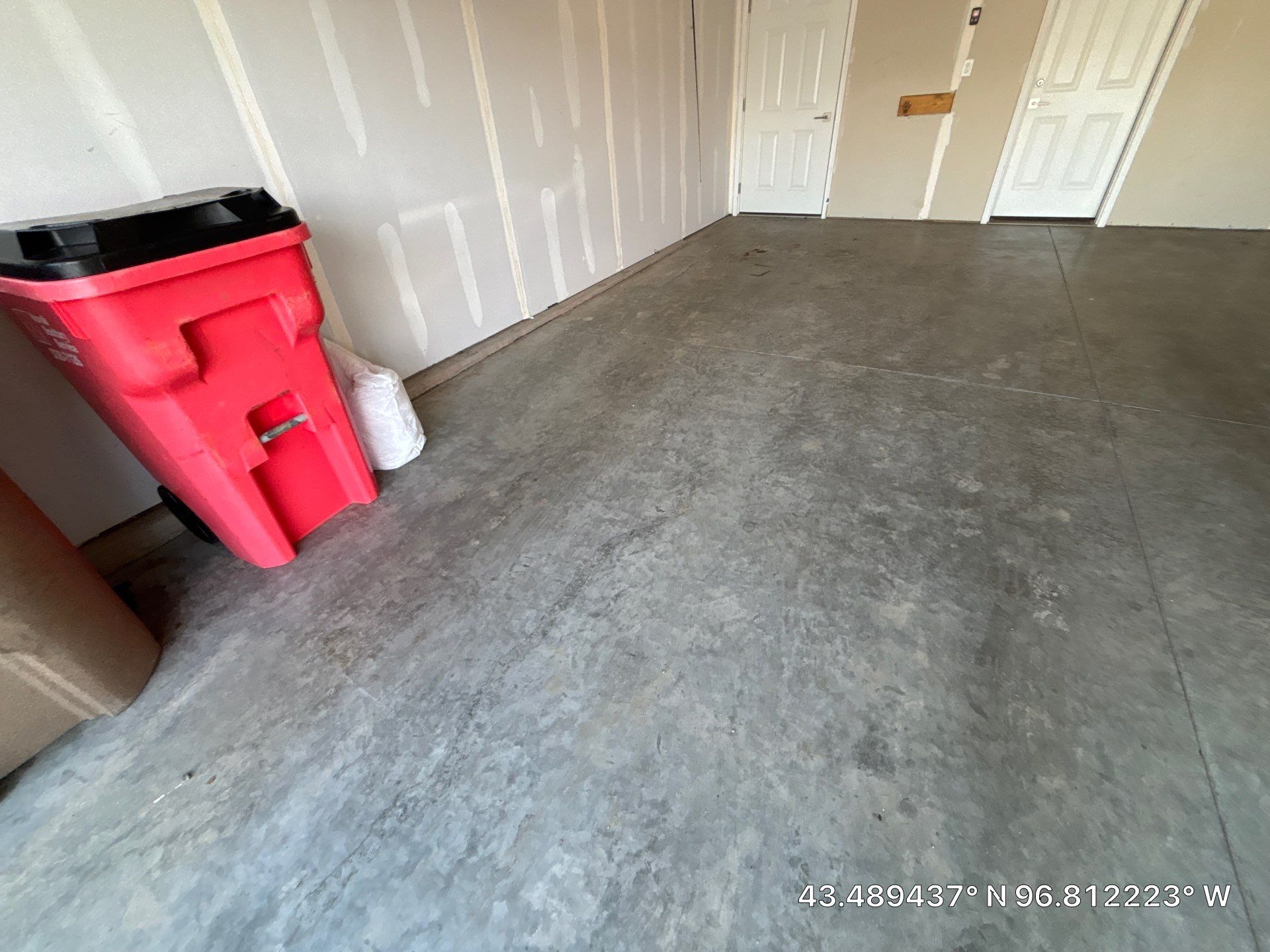 Custom Epoxy Garage Floor and Patio Coating in Sioux Falls by Select Painting, Coatings & Garage Cabinets