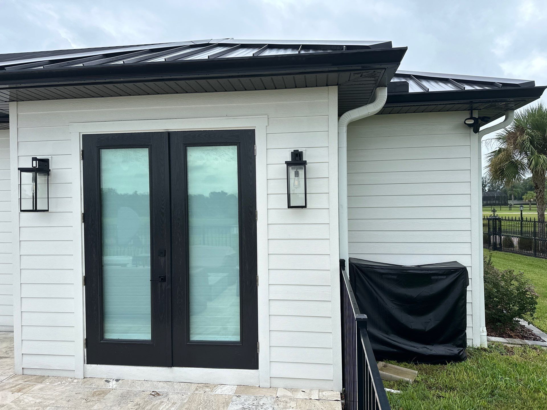 Complete Two-Story House Wash and Driveway Cleaning in Winding River Community, Bradenton, FL by Sunshine AquaWash