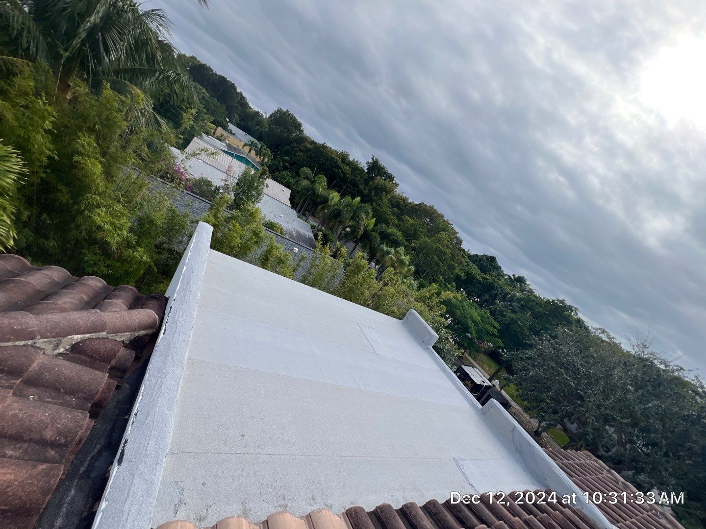West Palm Beach Roof Restoration and Travertine Paver Driveway Installation by Aastro Roofing