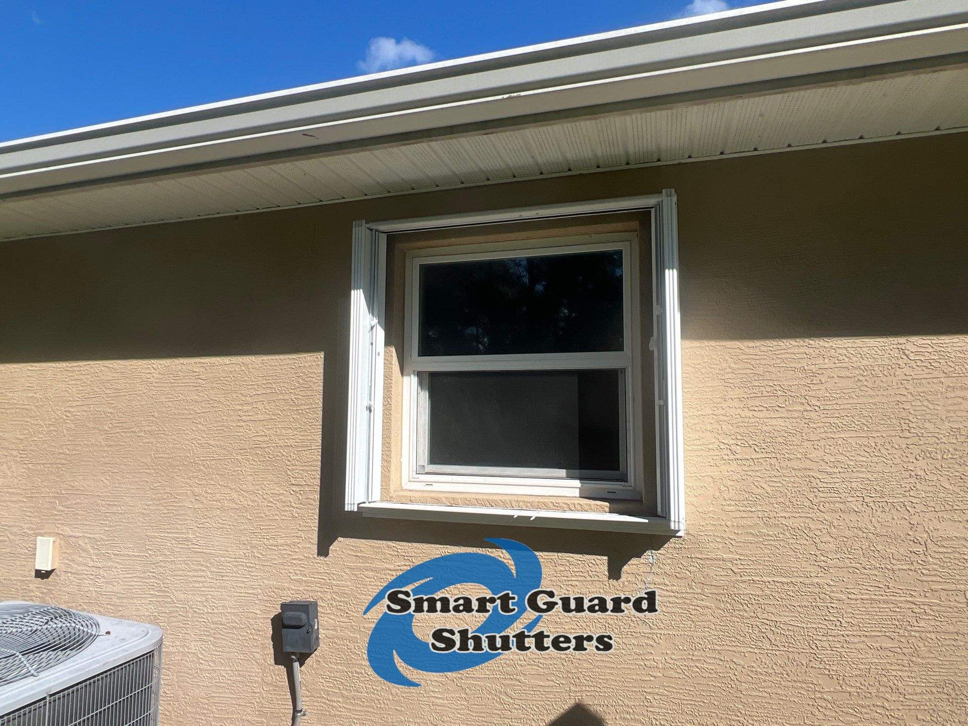 Accordion Shutters in White by Smart Guard Shutters