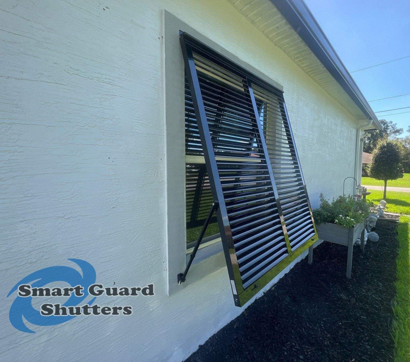 Impact Bahama Shutters in Jet Black by Smart Guard Shutters