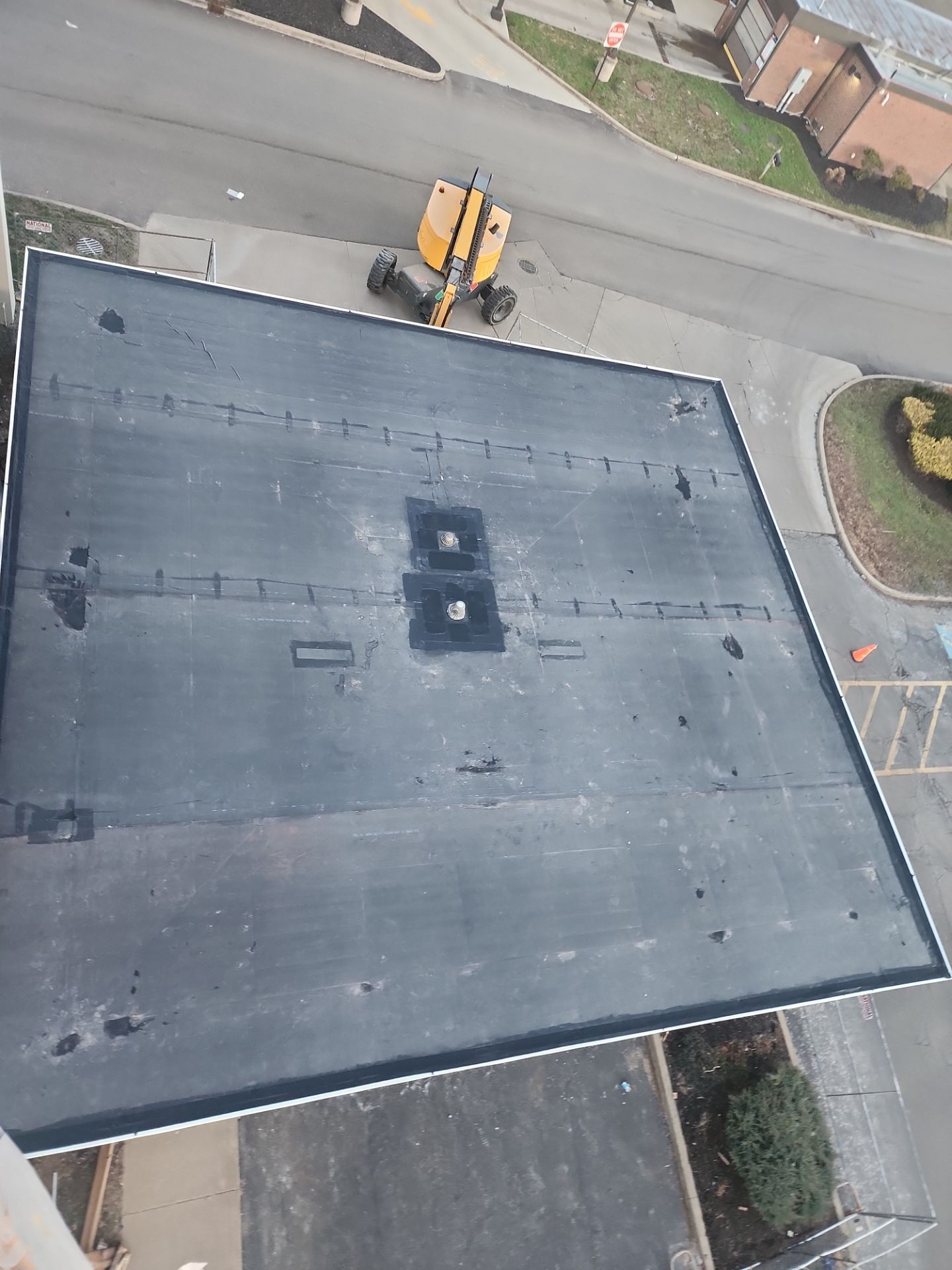 Commercial Roofing Installation using 60 mil rubber roof  by Nitro Roofing and Construction