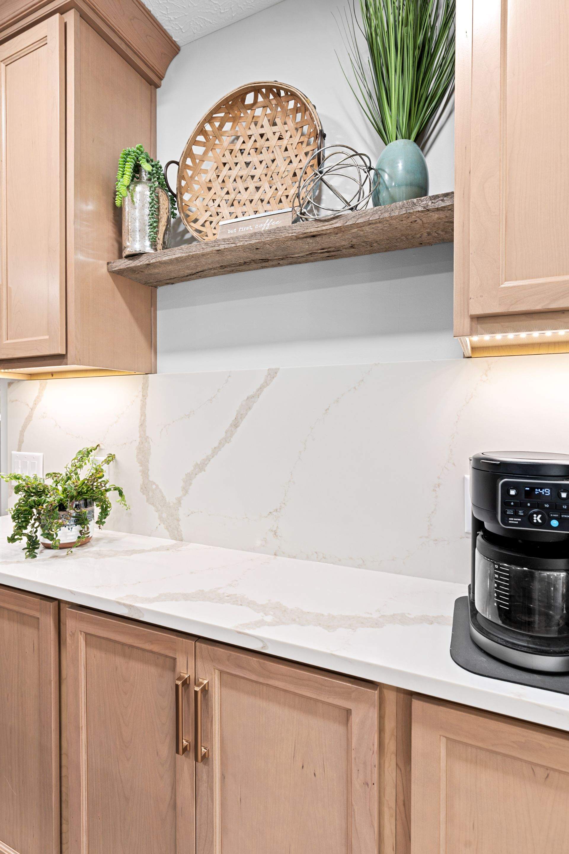Modern Kitchen Remodel Featuring Quartz Backsplash, under cabinet lighintg, and a coffee bar in Mt. Juliet Tennessee by DeRo Renovations,LLC