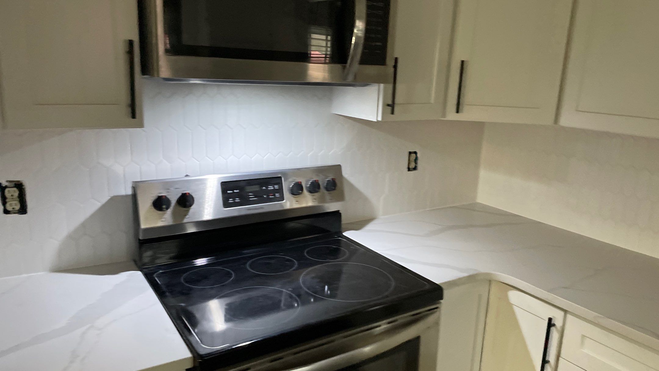 Kitchen Backsplash and Herringbone Tile Floor Remodel by Footprints Floors of Coastal Carolina