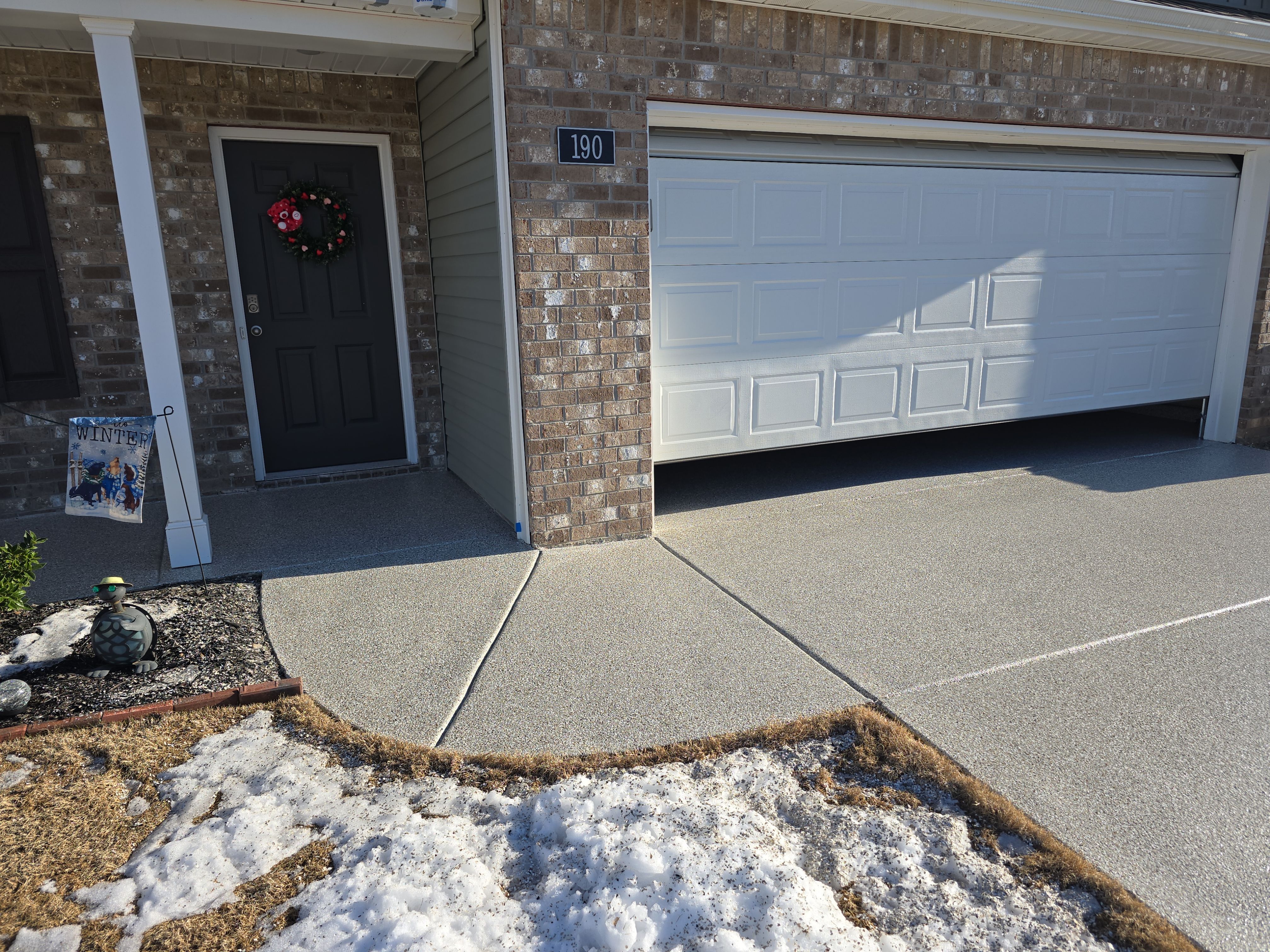 Driveway, Garage, & Front Porch using Creekbed by Elite Floor Solutions