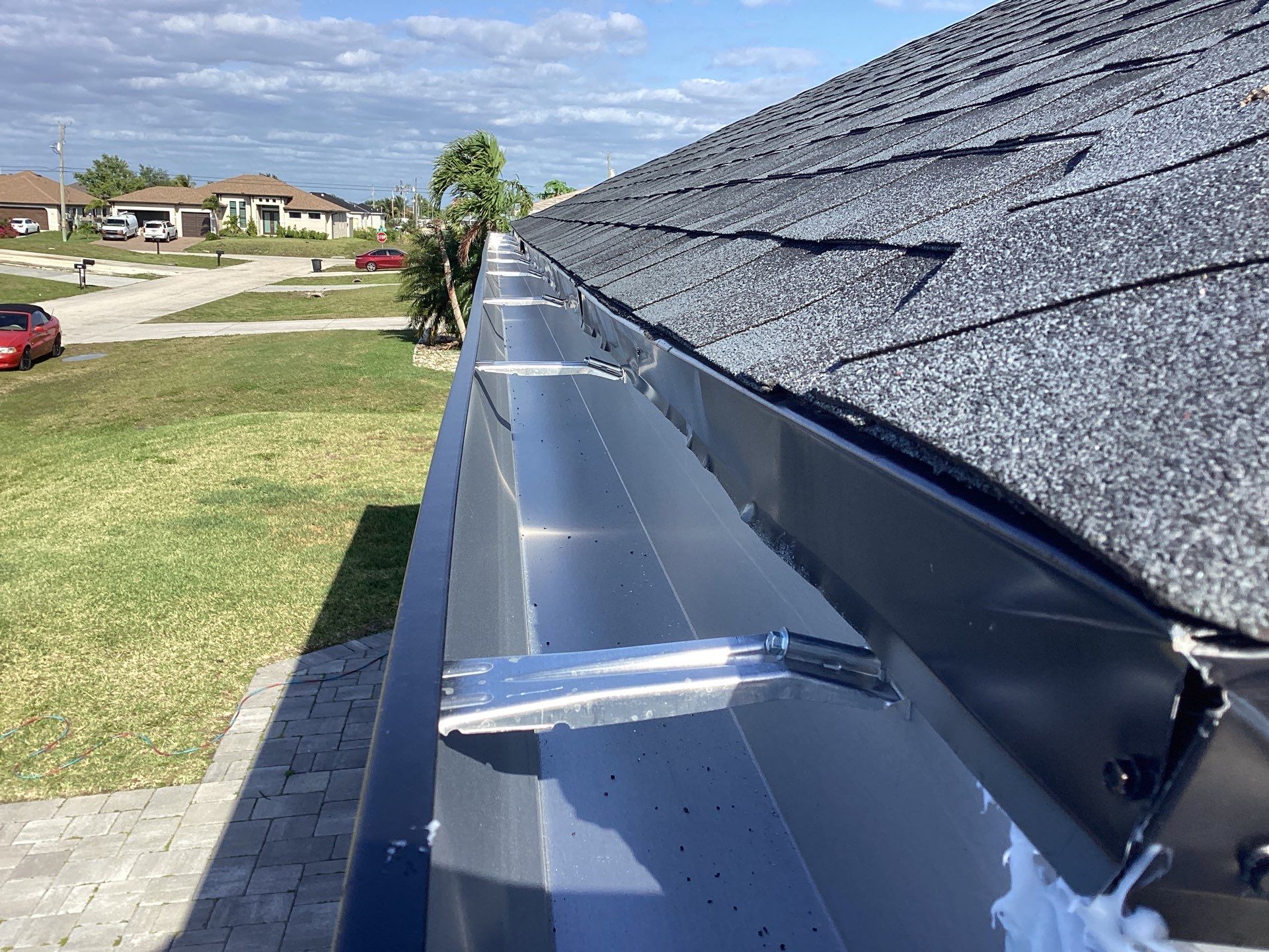 Black Seamless Gutters using 6 Inch Seamless Gutters in Cape Coral FL by Gutter Professors