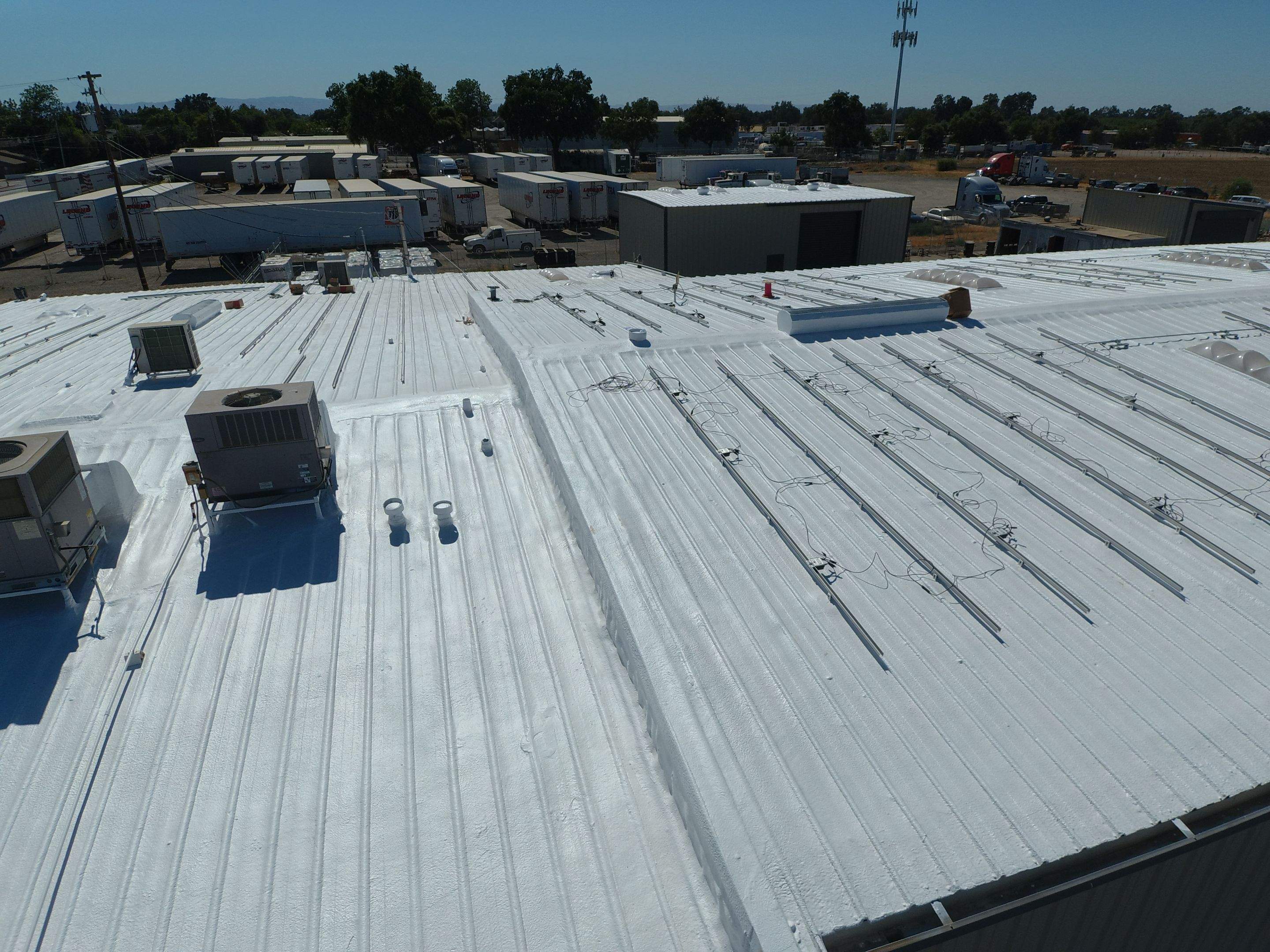 Spray foam and coatings using Conklin Benchmark/PUMA XL coatings and spray foam by Straight Edge Roofing Inc