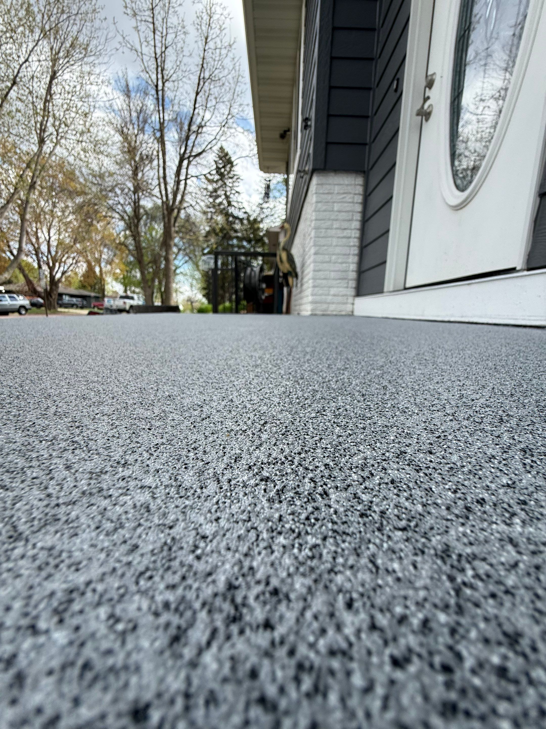 Grey Polyaspartic Porch and Stair Resurfacing in Sioux Falls by Select Painting, Coatings & Garage Cabinets