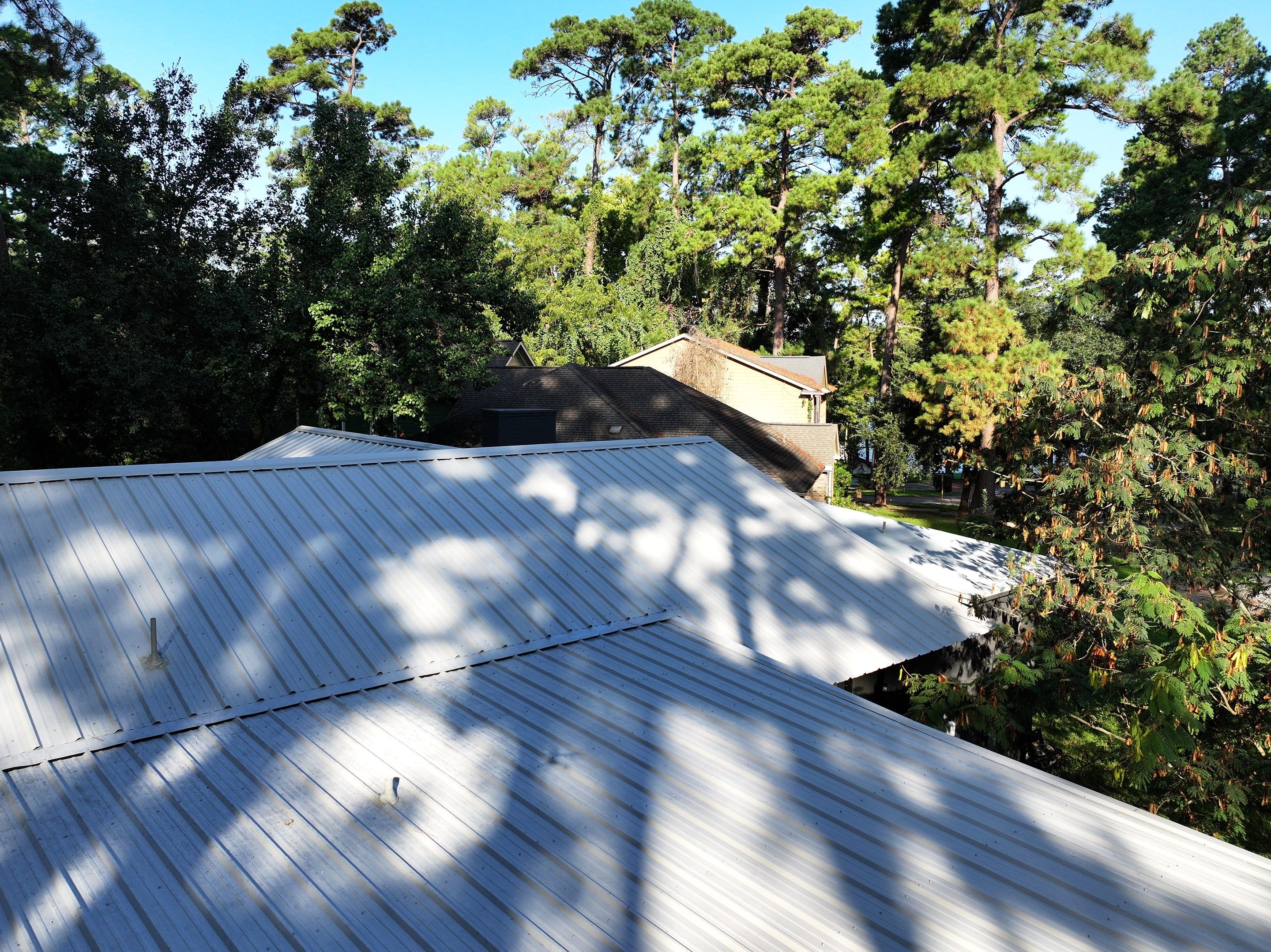 White Standing Seam Metal Roof Replacement in Willis, Texas by Abbott Roofing Company