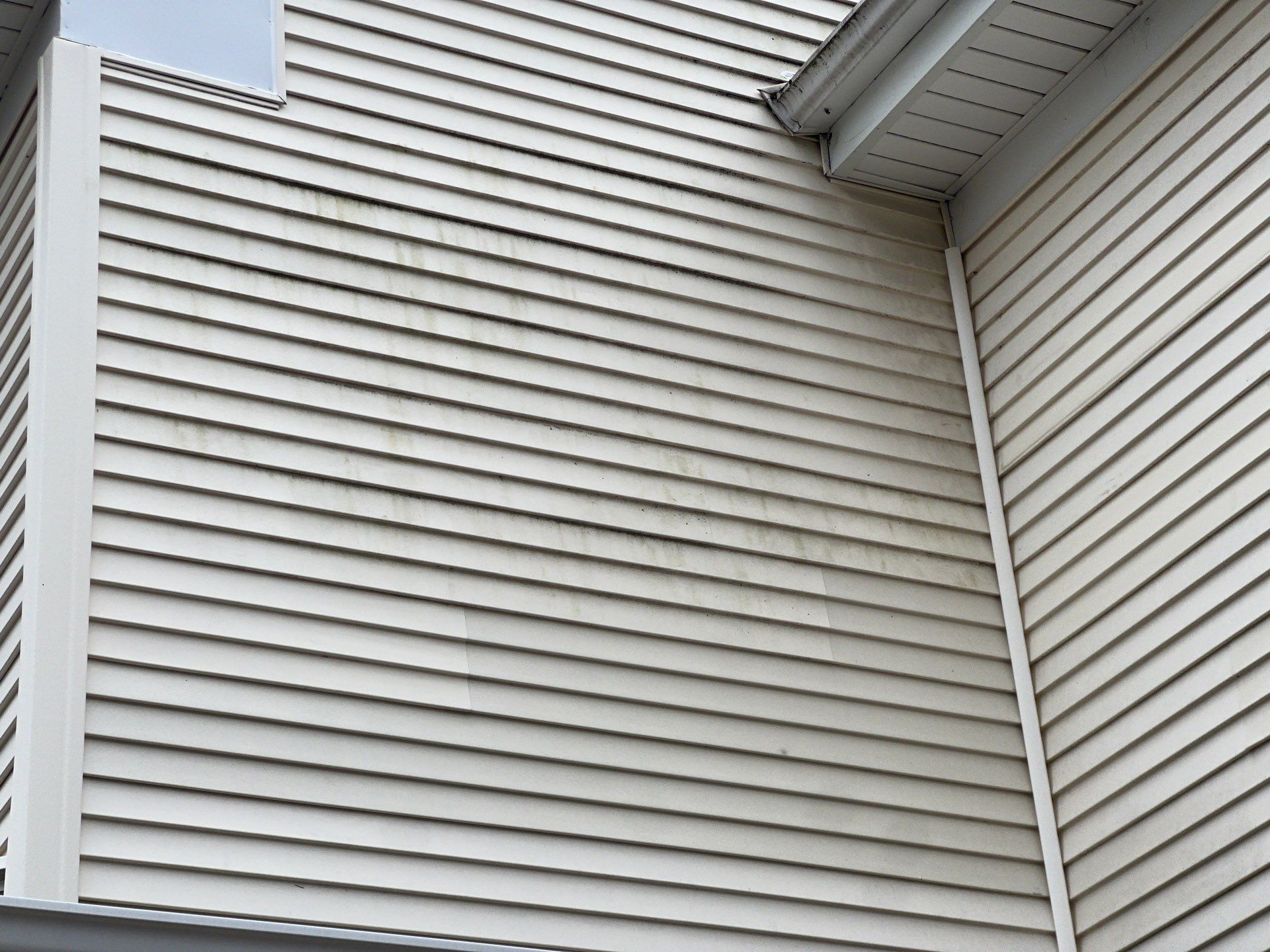 Housewashing  using Algaecide, soft wash soap by Northern Power Washing LLC.
