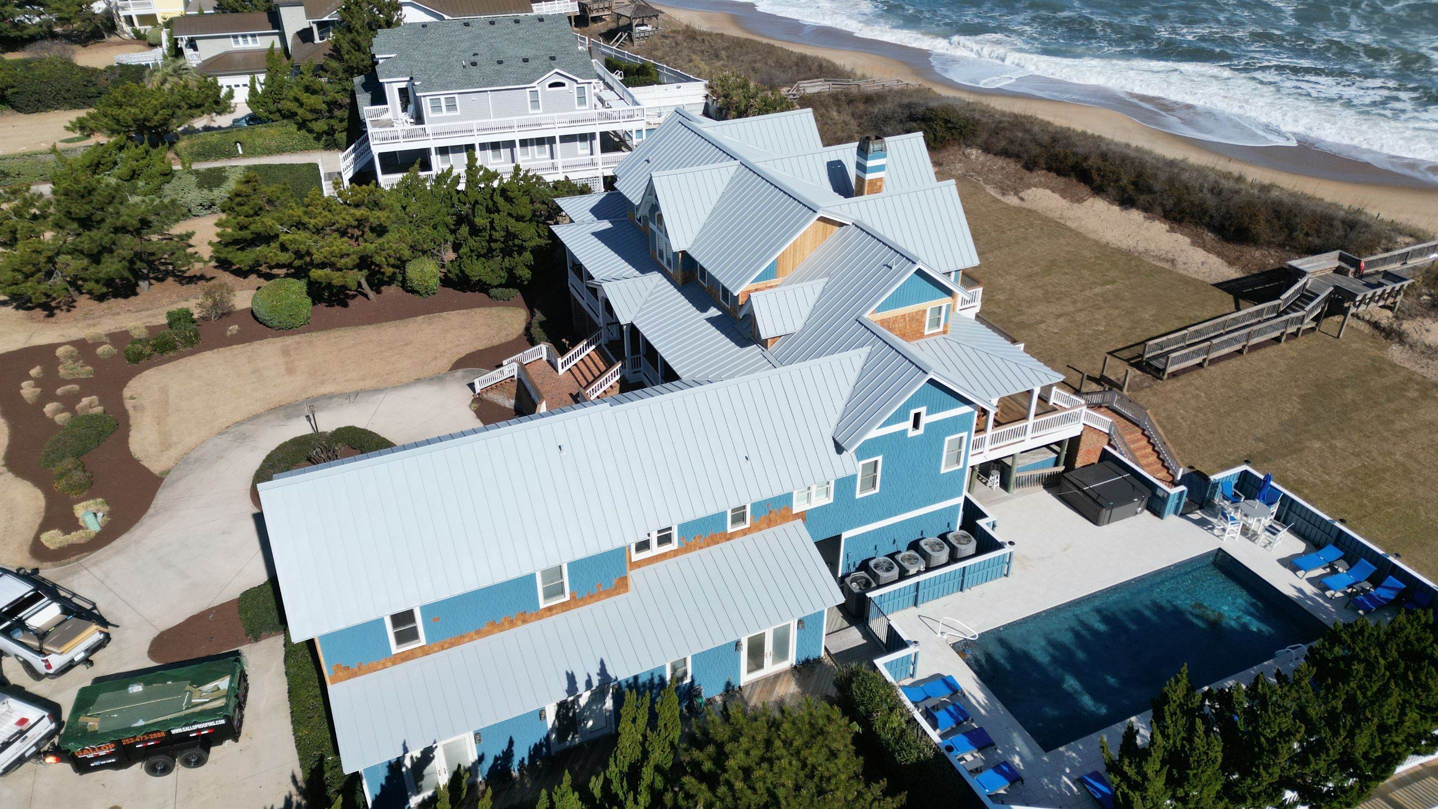 Large Metal Roof Transformation by Gallop Roofing & Remodeling, Inc.
