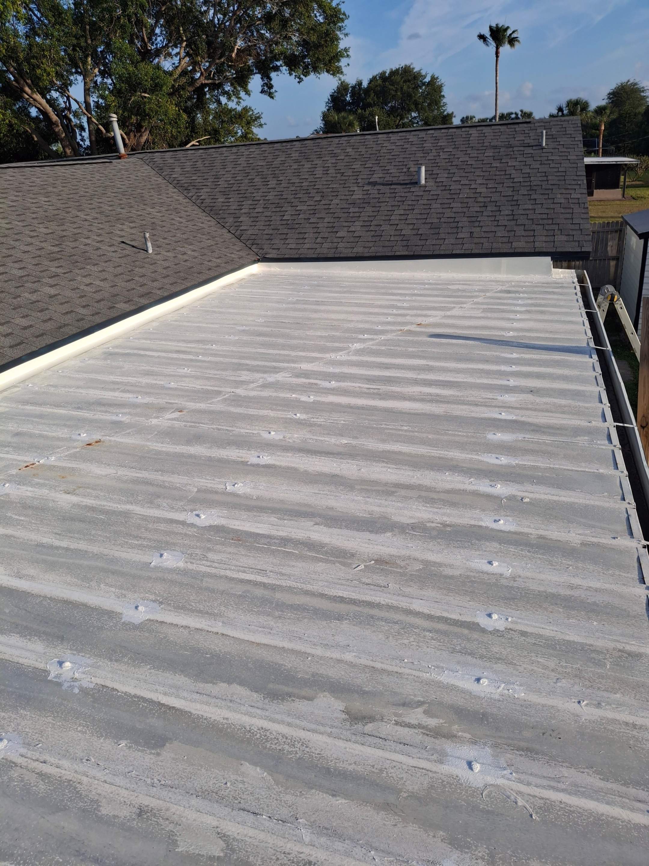 Aluminum Roof Sealing and Protective Liquid Coating in Melbourne by Florida Roofing and Renovations Inc.