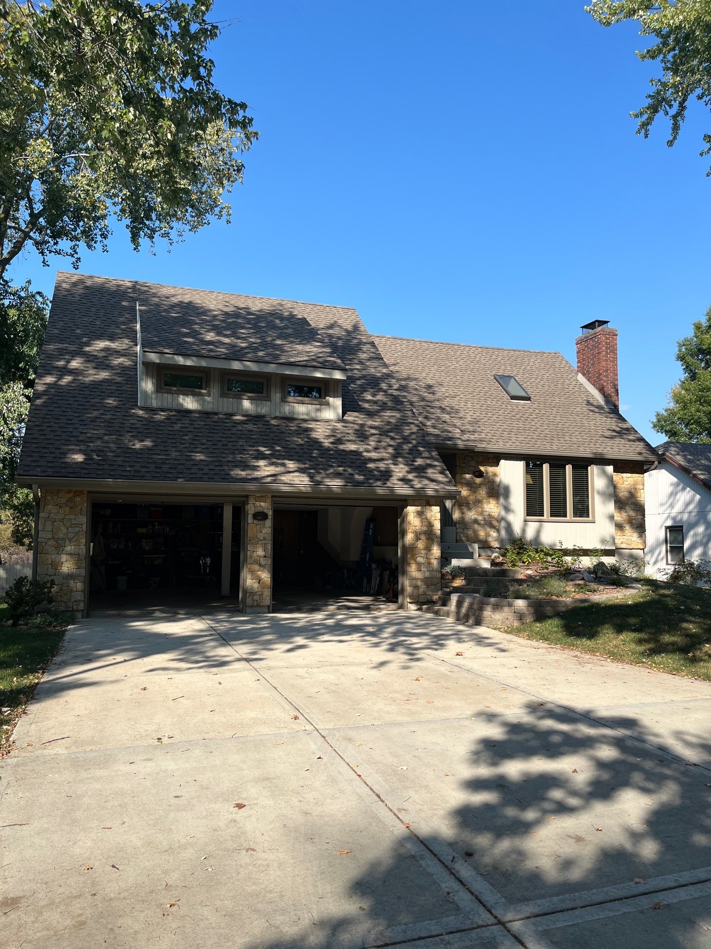 Comprehensive Kansas City Exterior Remodel Featuring Board And Batten Siding by EEC Windows, Siding & Roofing