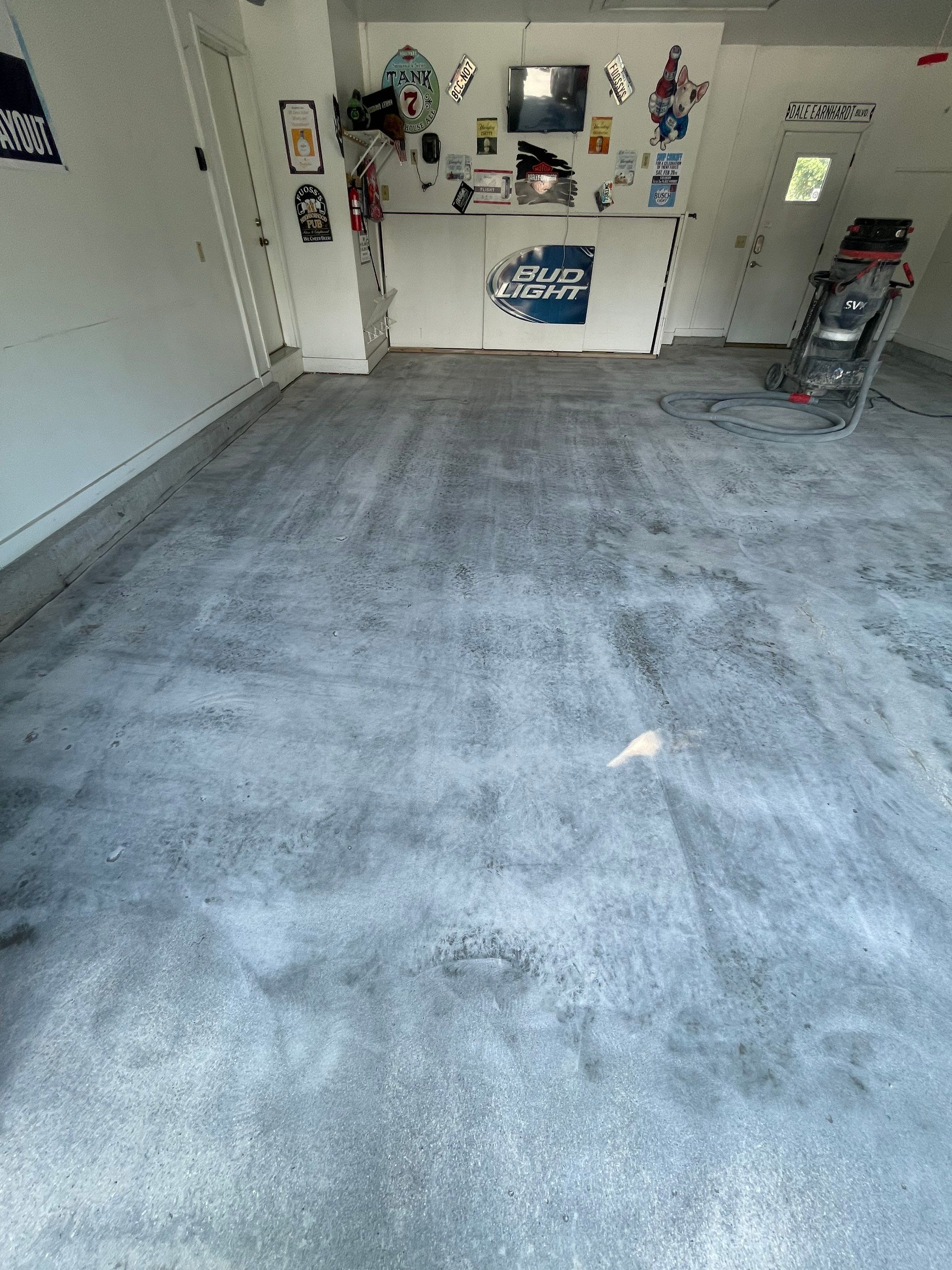 Residential Garage Floor Coating with Feather Grey Finish in Sioux Falls by Select Painting, Coatings & Garage Cabinets