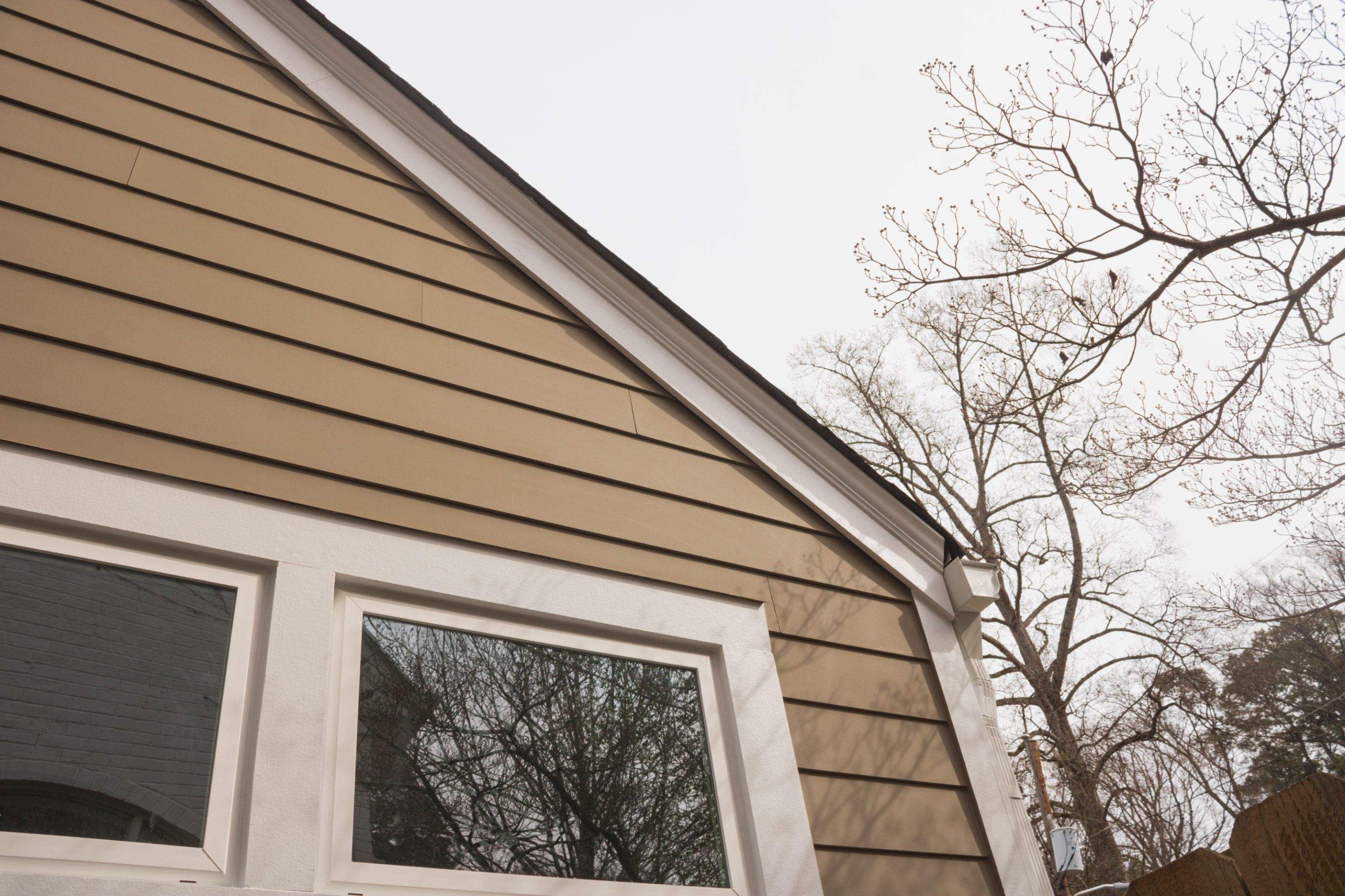 Full Siding Replacement, Deck Build, Exterior Paint, and Gutter Replacement  by Nelson Exteriors 