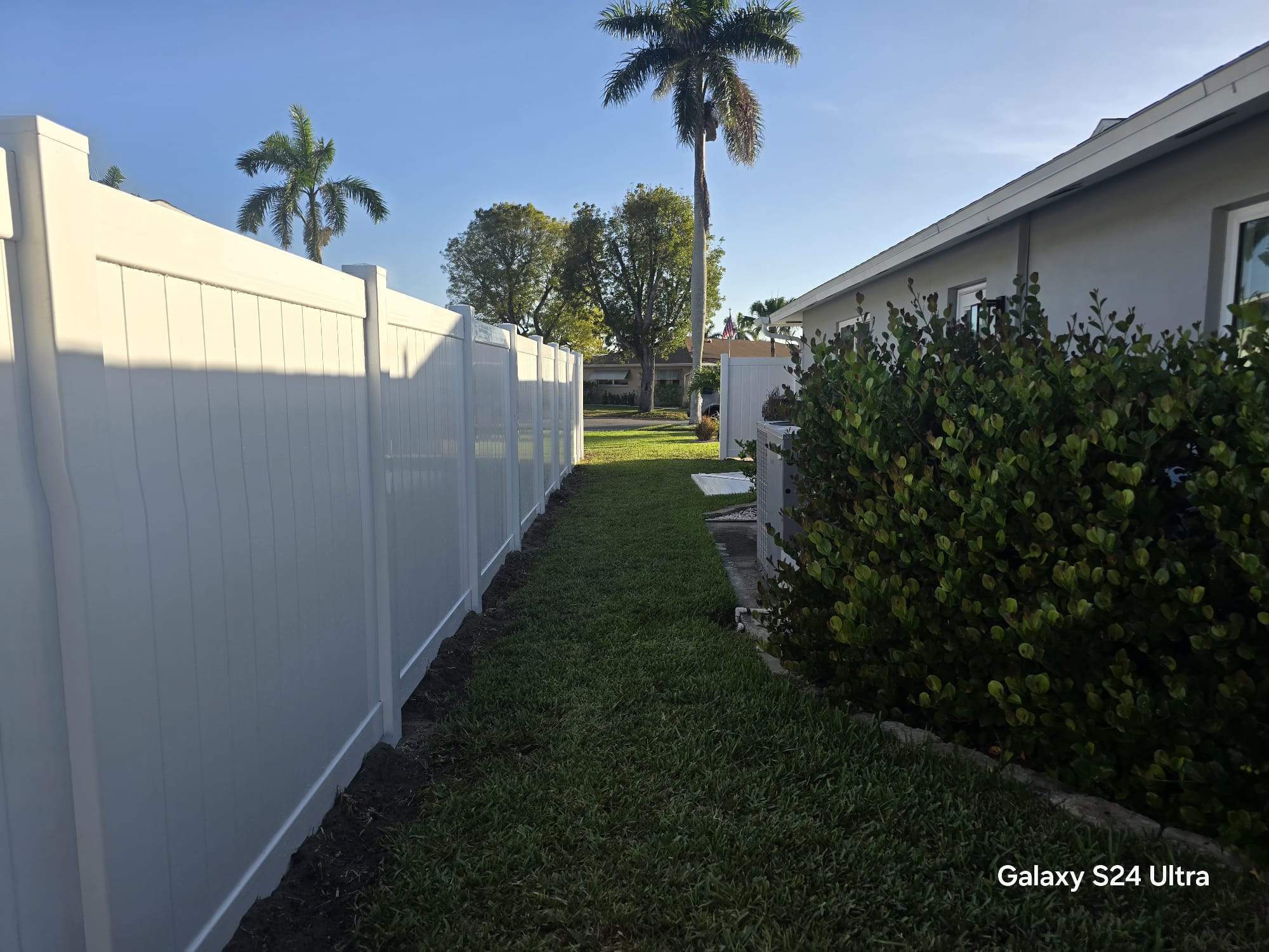 White Vinyl Privacy Fence and Double Gate Installation in Fort Myers by True Fence LLC
