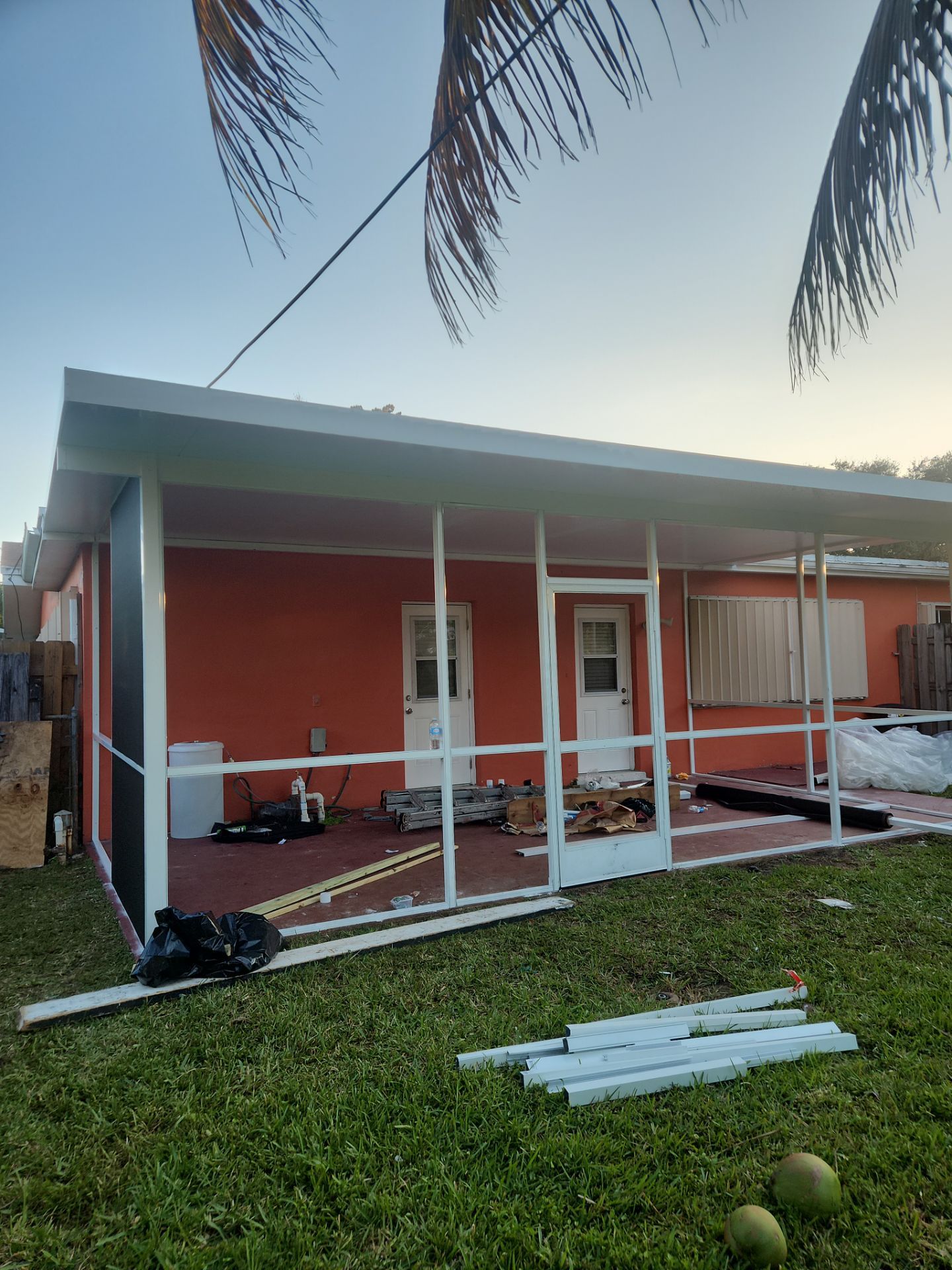 Insulated Screen Enclosure and Wood Tile Deck Installation in Plantation by Aastro Roofing