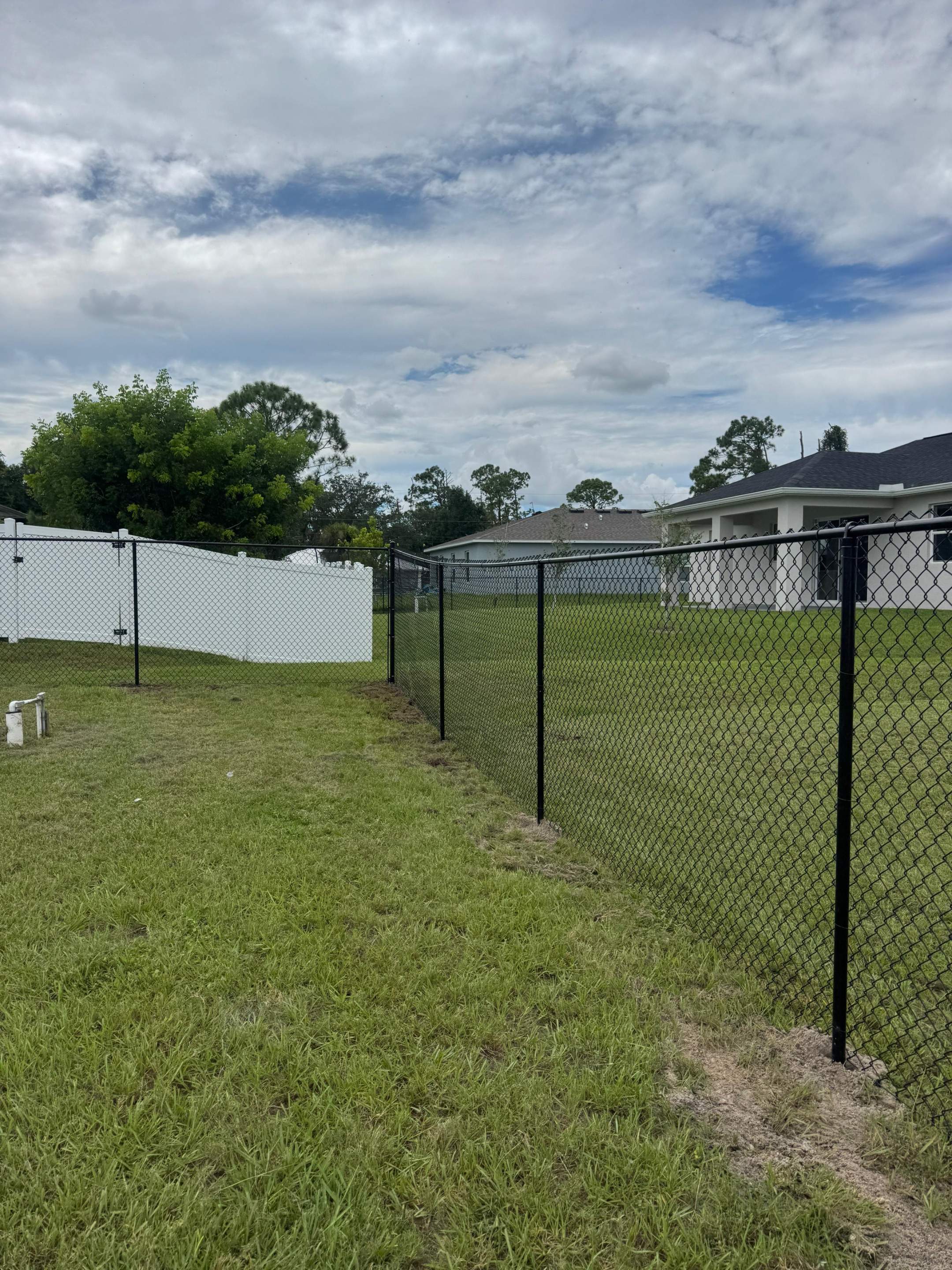 Residential Black Chain Link Fence Installation in North Port by True Fence LLC