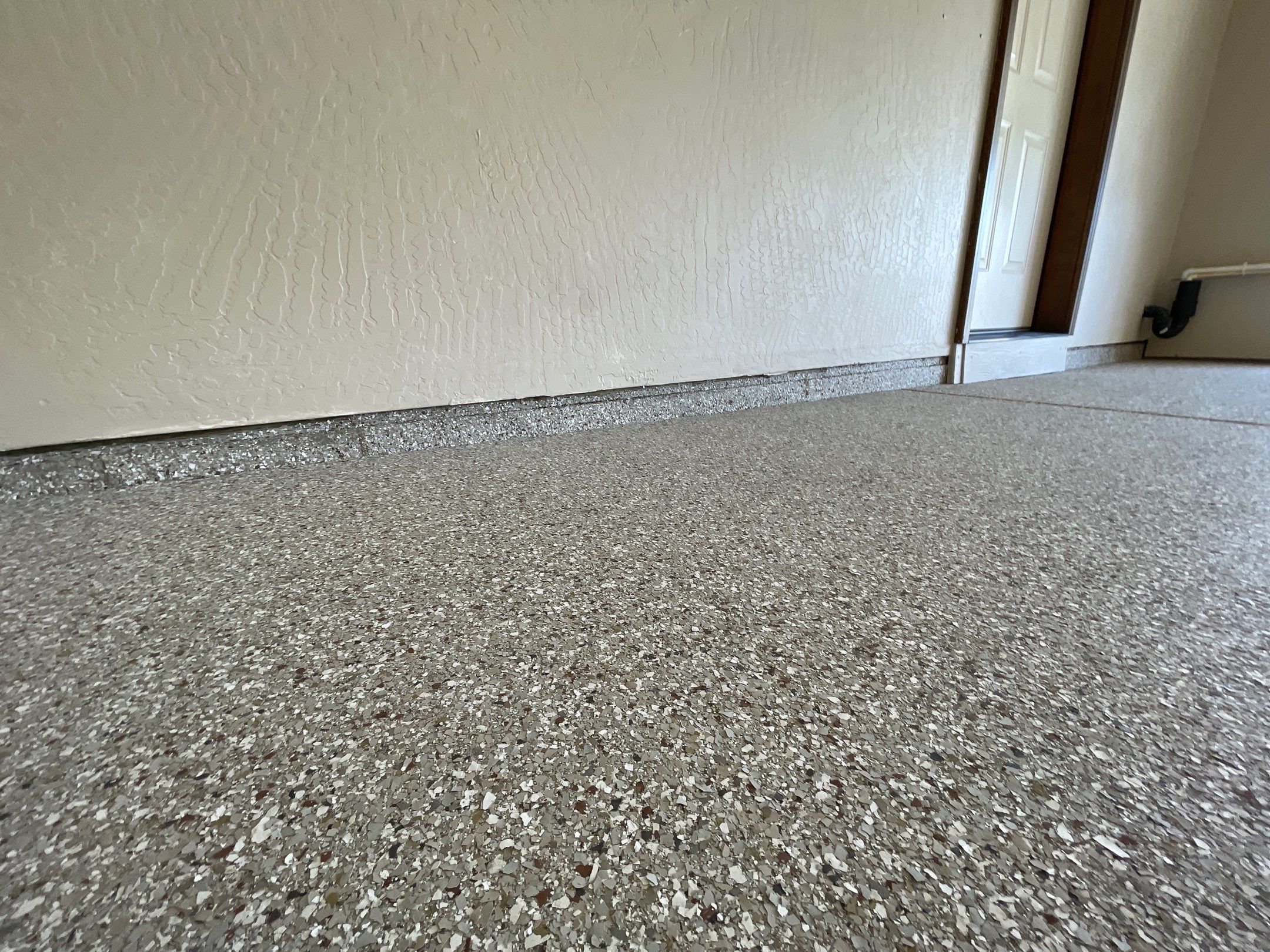 Garage Transformation using Pebble Beach and Front Porch using Greystone by Croc Coatings, LLC